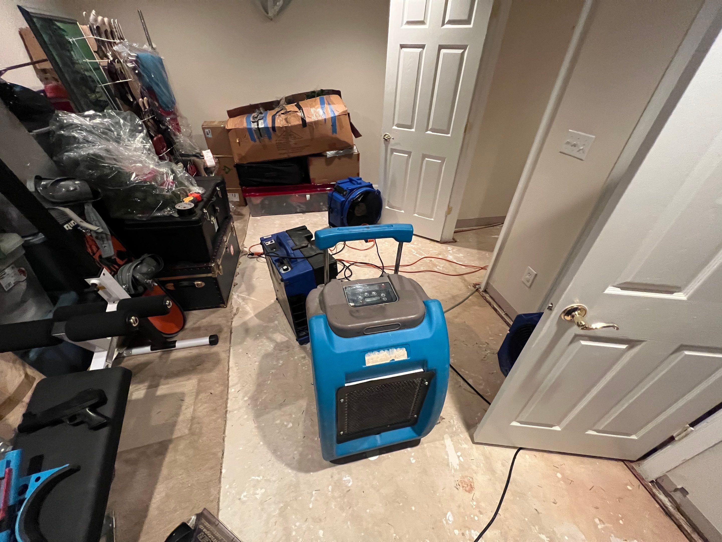 Continued dehumidification monitoring as structural drying advances toward completion.