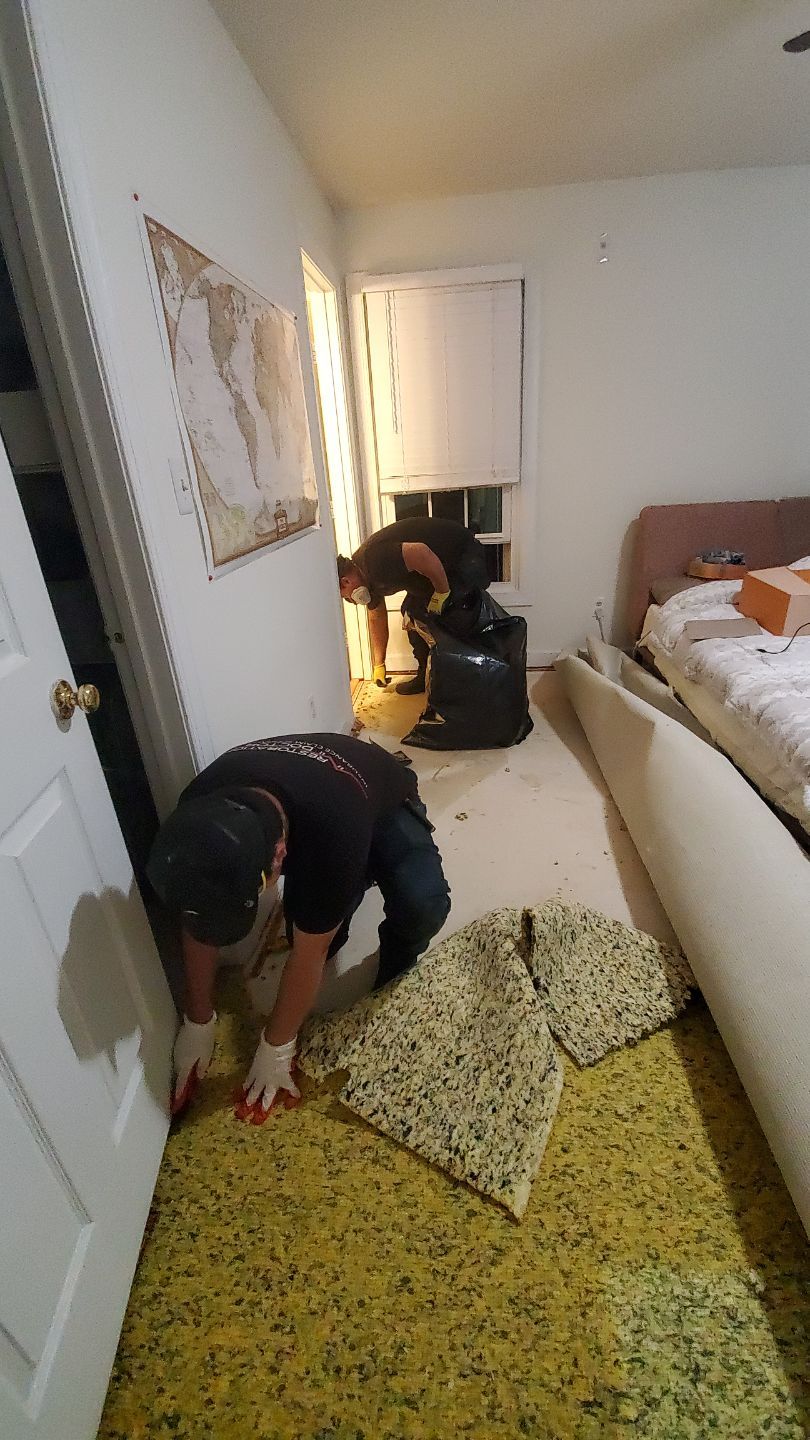 Standing water extraction underway during water damage restoration in Fairfax, removing pooled water from affected interior space.