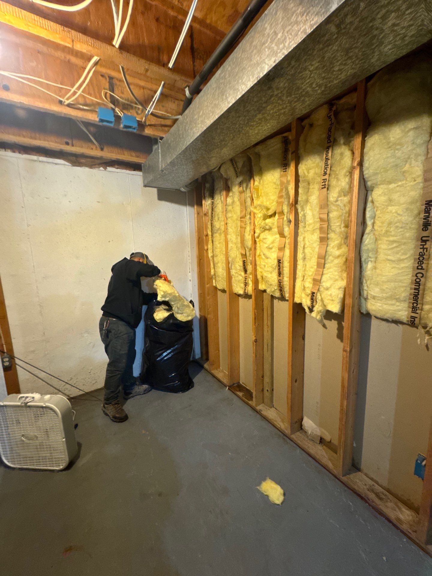Final-stage inspection of dried structural materials and prepared flooring areas following mold remediation completion.