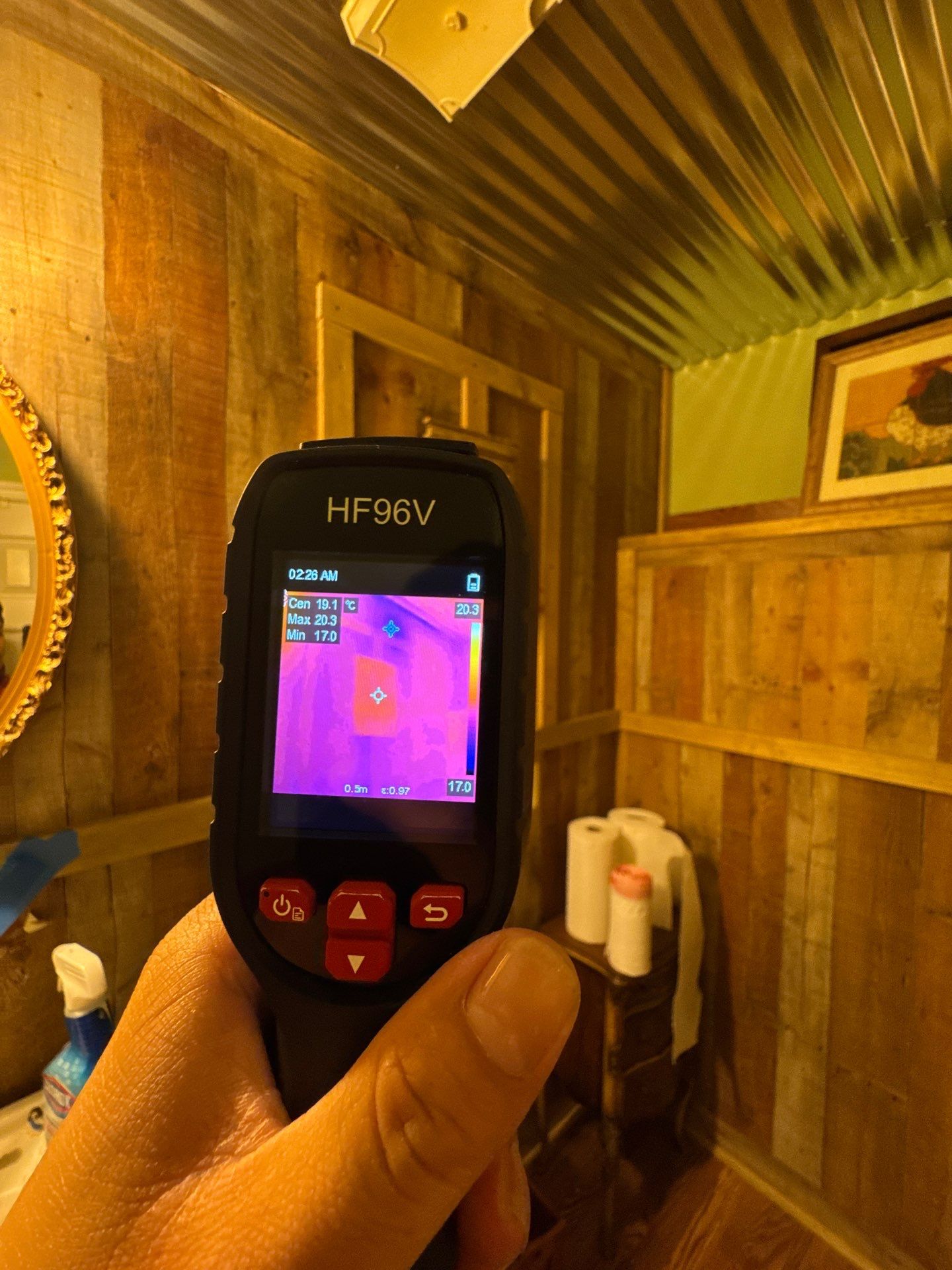 Thermal image mapping moisture concentration in structural materials during restoration inspection.