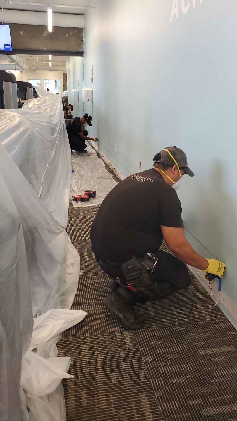 Industrial dehumidifier operating mid-restoration to control humidity levels during water damage recovery.