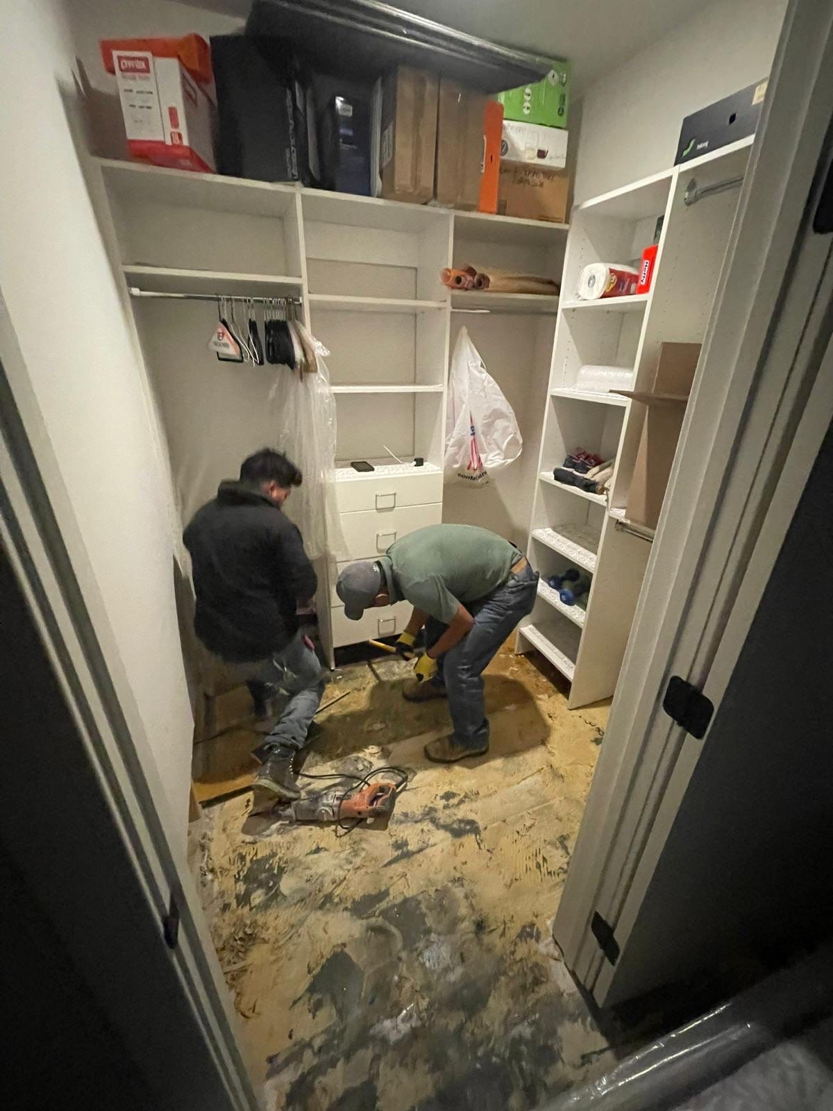 Standing water extraction underway during water damage restoration in Arlington, Virginia.