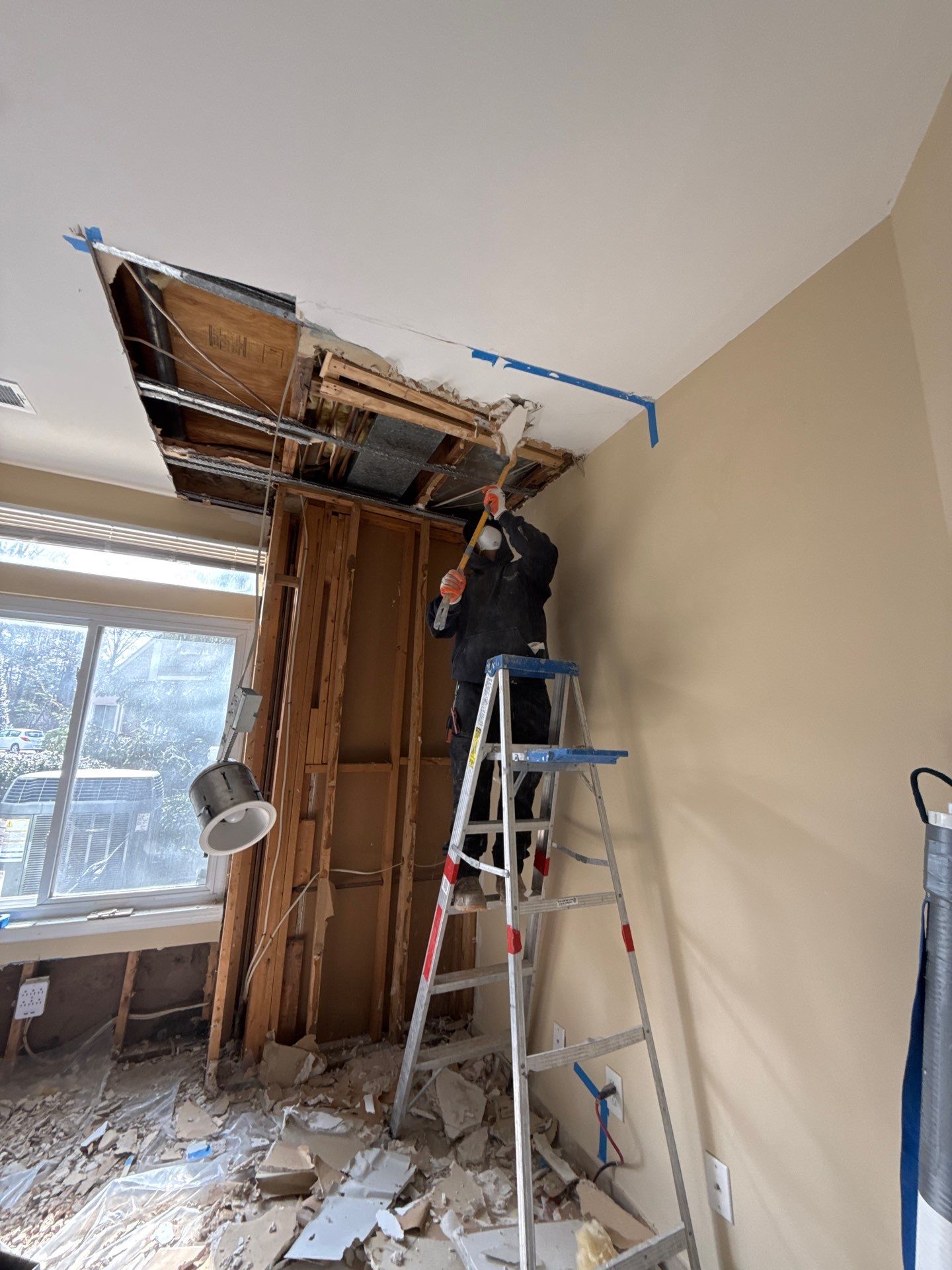 Ceiling framing exposed and dried as part of mold remediation containment process in Fairfax.