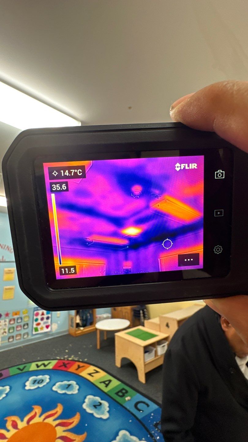 Thermal imaging inspection identifying moisture patterns during water damage drying process.
