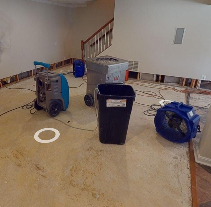 Baseboard removal and preparation for replacement as part of water damage restoration in Annan.