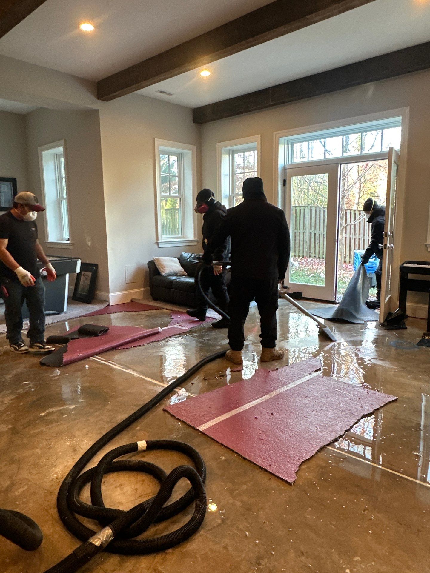 Initial water damage assessment in Arlington home showing flooded areas requiring restoration.