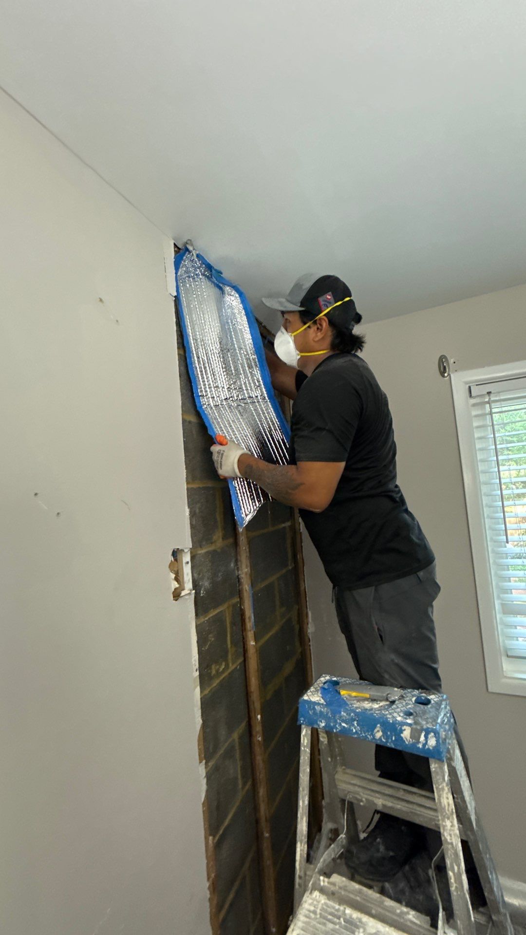 Dehumidifier and moisture monitoring equipment positioned in water-damaged Chantilly home during initial assessment phase.