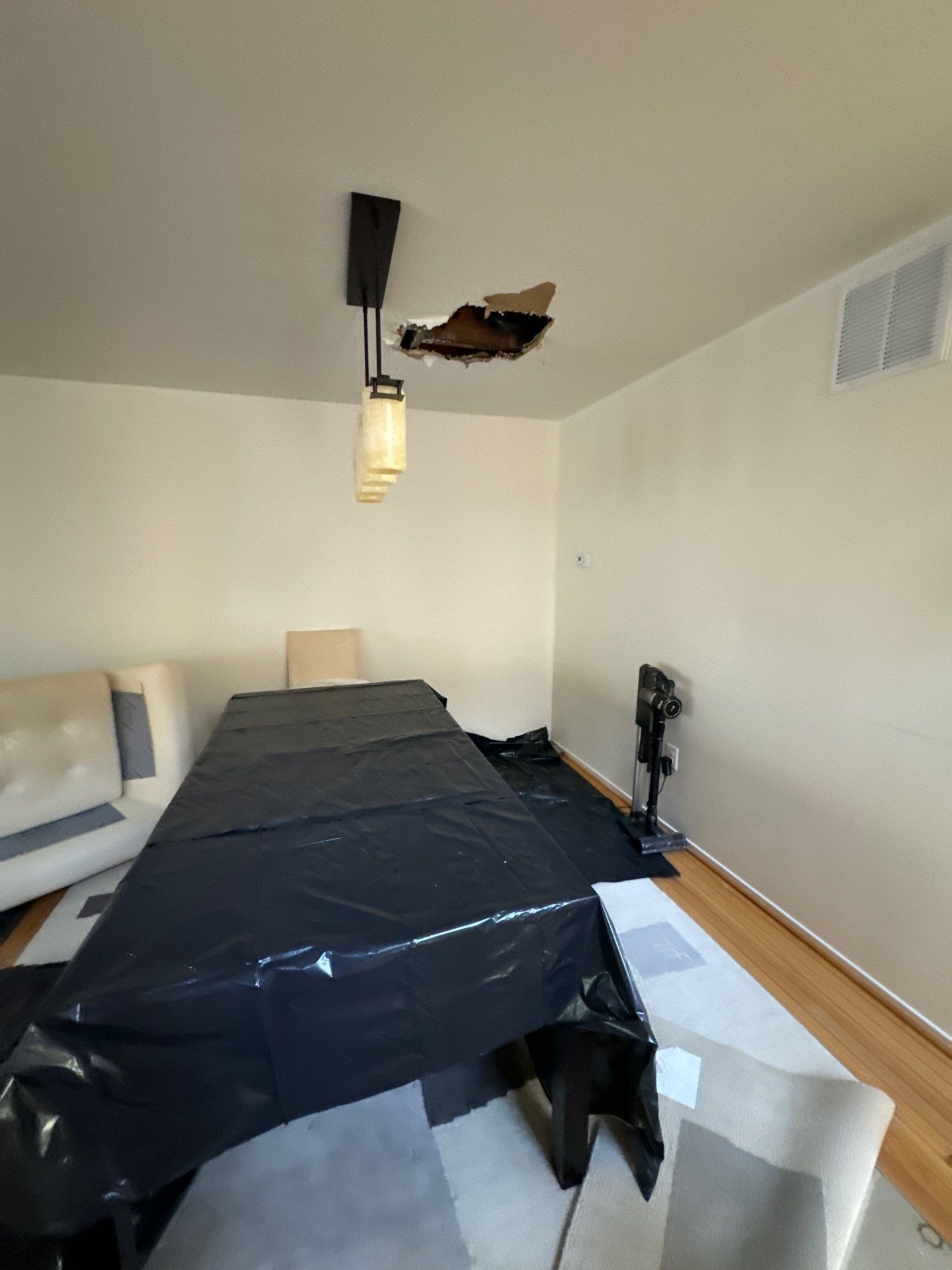 Dehumidification equipment positioned in affected room during water damage mitigation in Fairfax.