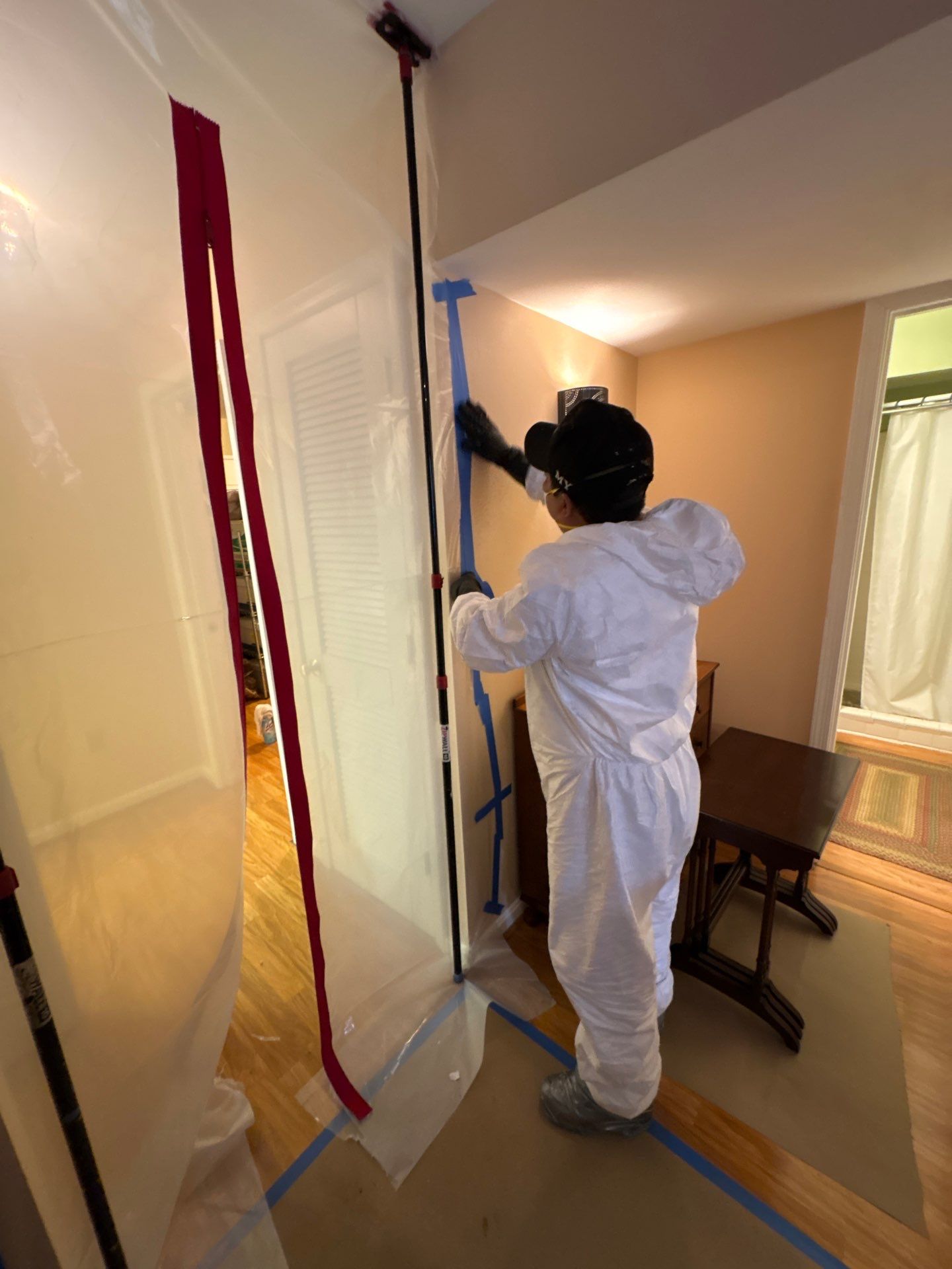 Wet drywall section marked for removal as part of water restoration protocol in Falls Church.