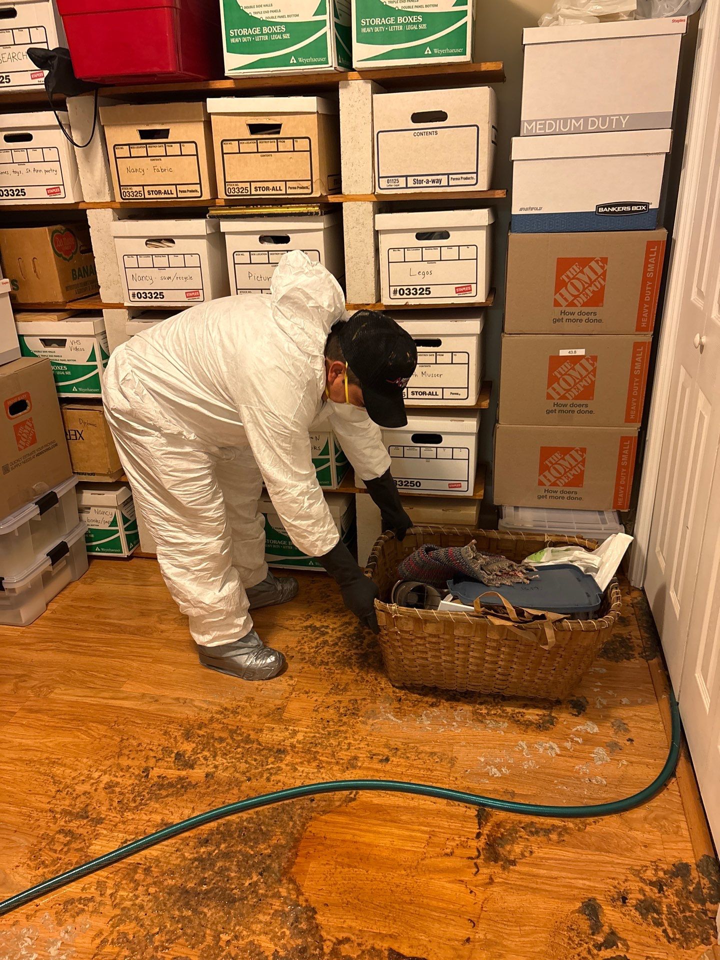 Structural drying equipment positioned throughout affected room during water damage mitigation in Falls Church.