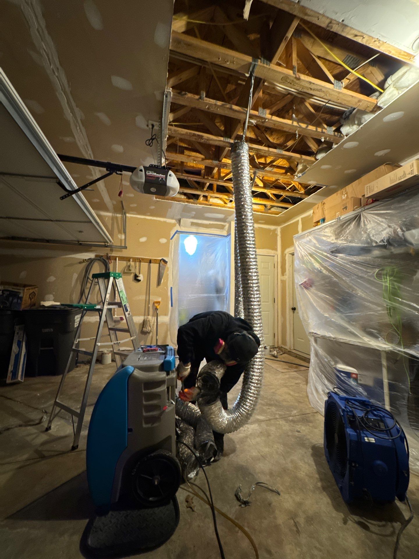 Repaired ceiling drywall installed and finished after moisture remediation and sanitizing in Haymarket home.