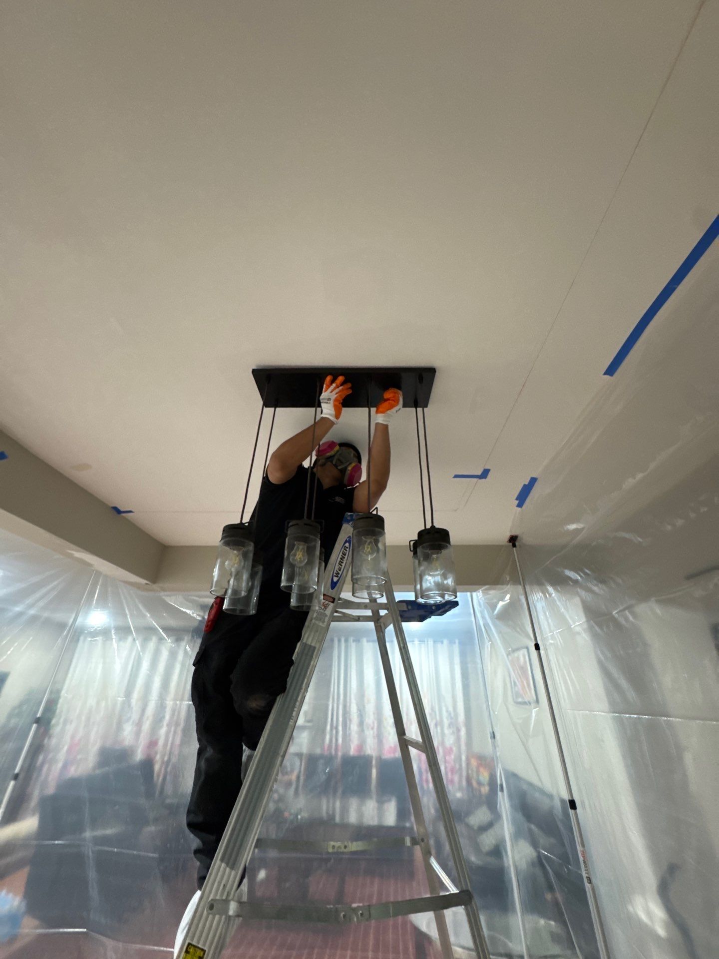 Ceiling section removed to expose structural damage and allow moisture remediation and sanitizing treatment.