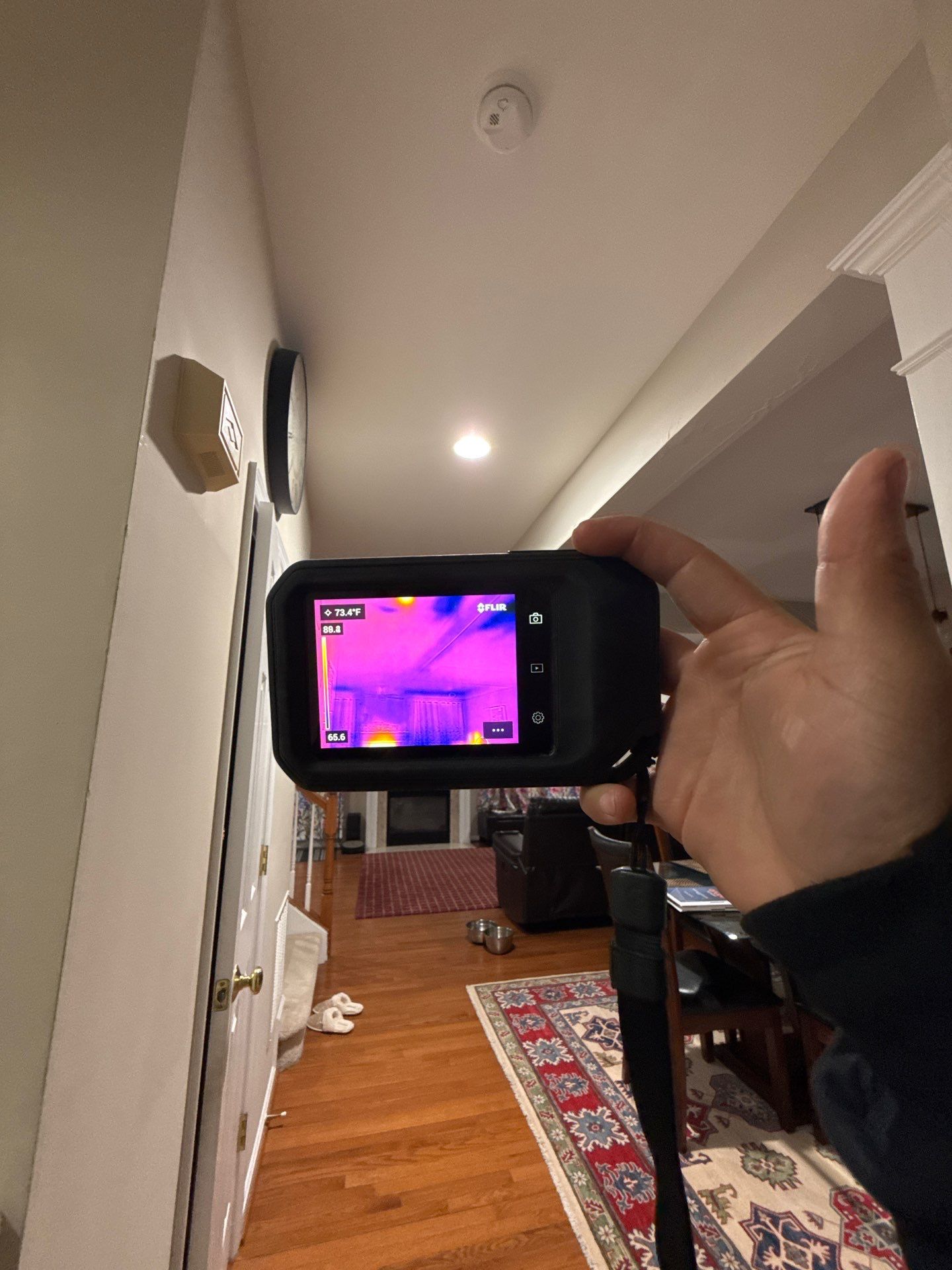 Thermal imaging camera documenting moisture patterns in ceiling during water damage assessment in Haymarket.