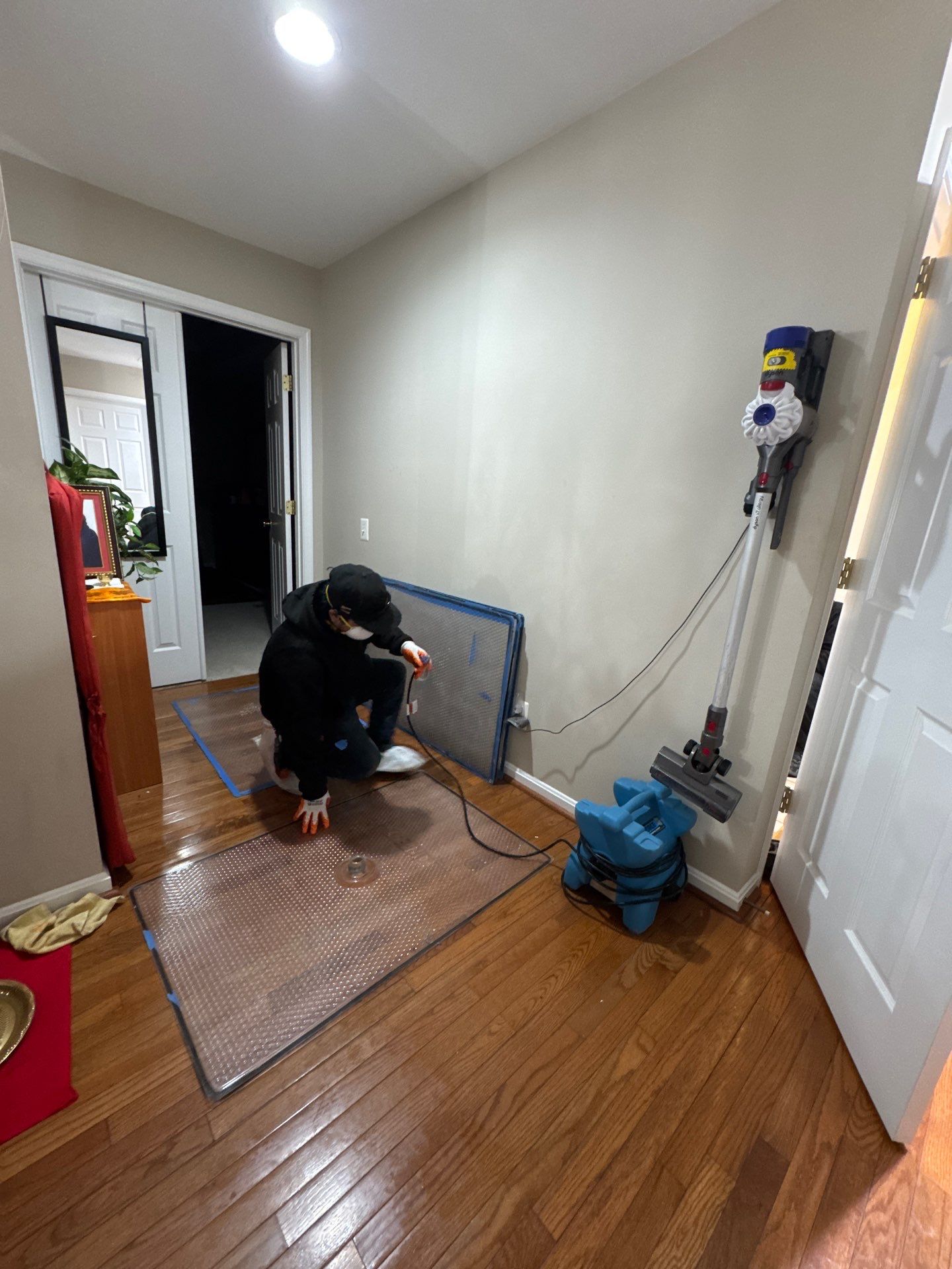Antimicrobial application being applied to exposed framing and substrate following water damage removal.