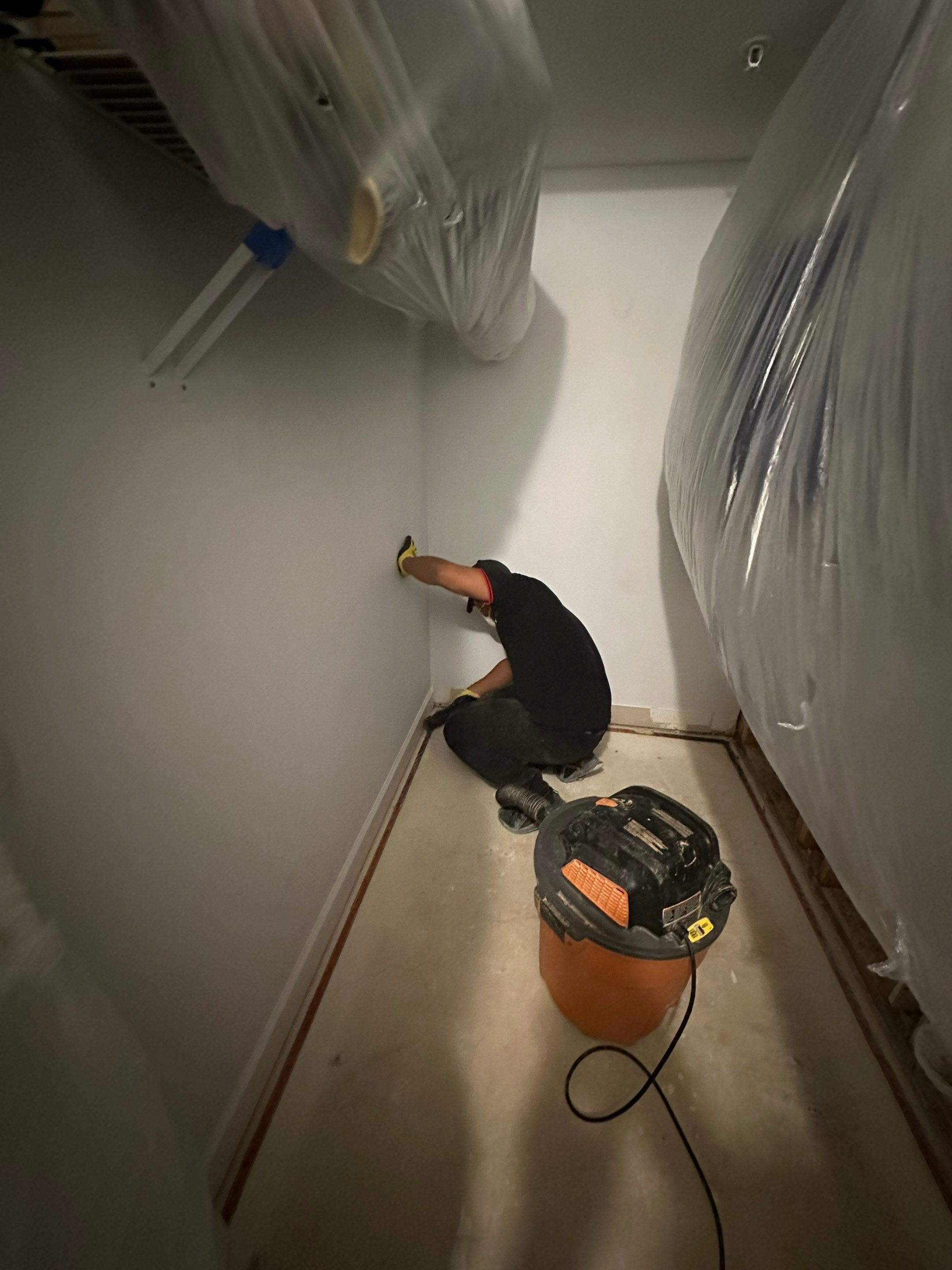 Mid-stage drying phase showing dehumidifier placement and structural assessment of ceiling repair scope.