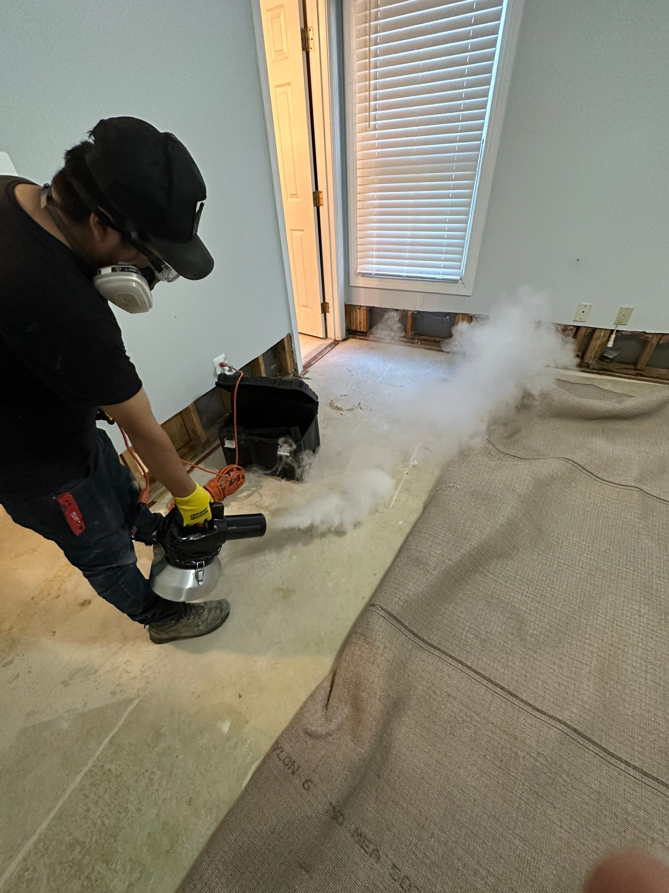 Final-stage water restoration in Fairfax with ceiling repair completed and drying equipment removal underway.