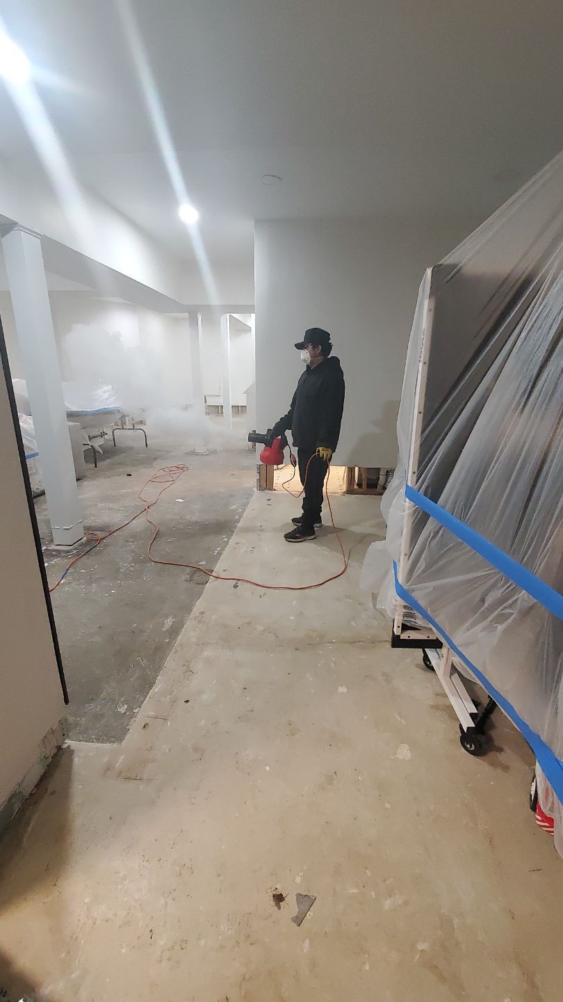 Structural drying in progress with dehumidifiers and air movers working to remove moisture from affected areas.