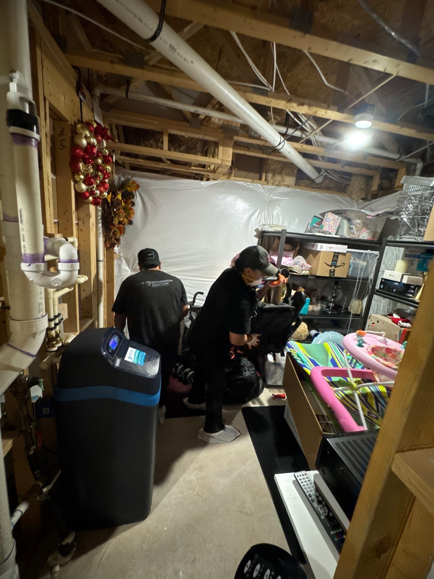 Water damage restoration in Aldie: wet flooring and carpet removal during initial assessment and drying setup.