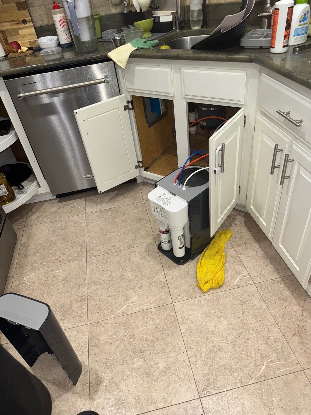 Structural drying in progress with dehumidifiers and air movers positioned throughout affected area.