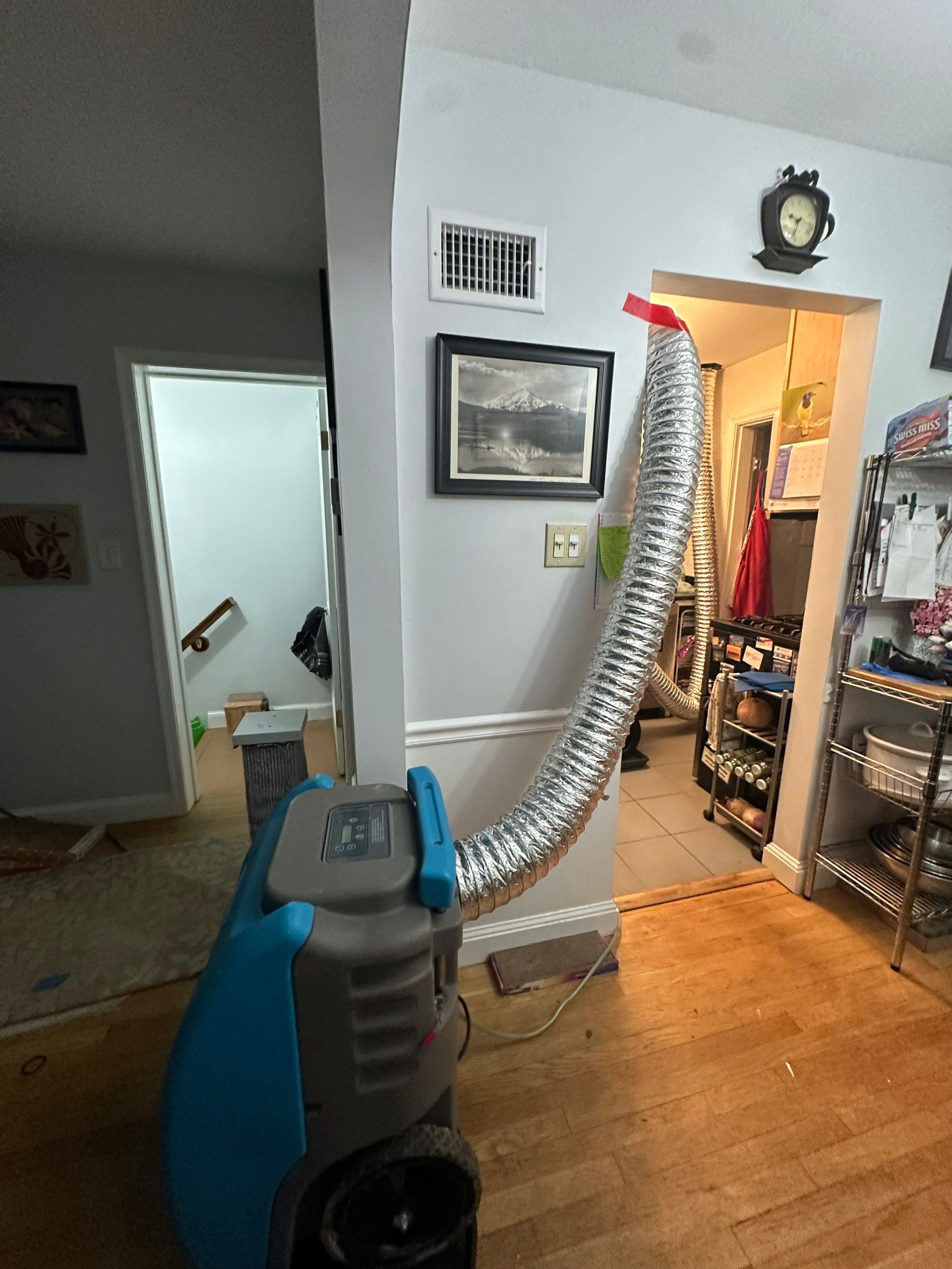 Dehumidification equipment positioned for structural drying during Arlington water damage restoration.