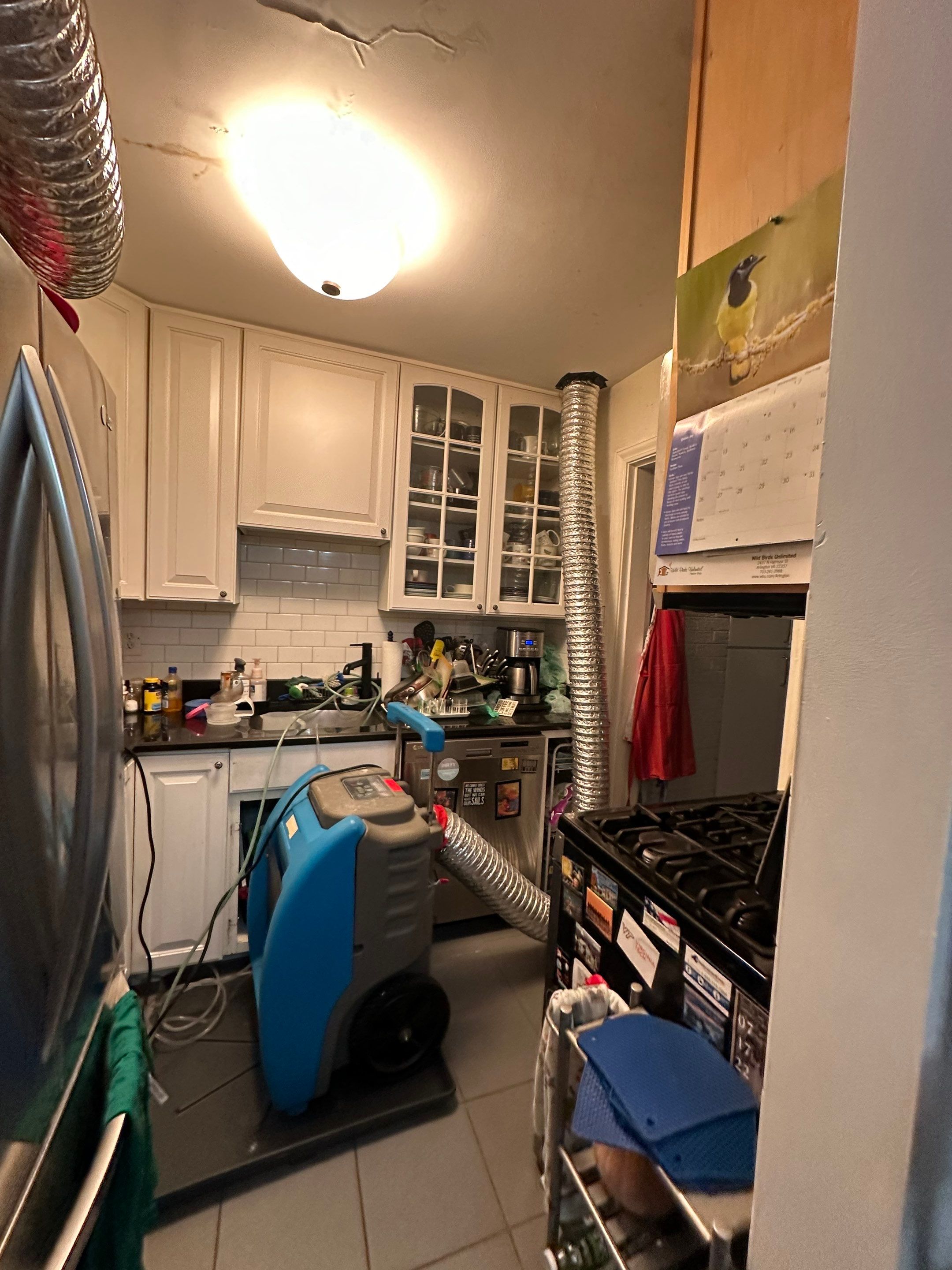 Continued dehumidification and drying cycle monitoring in Arlington water damage recovery.