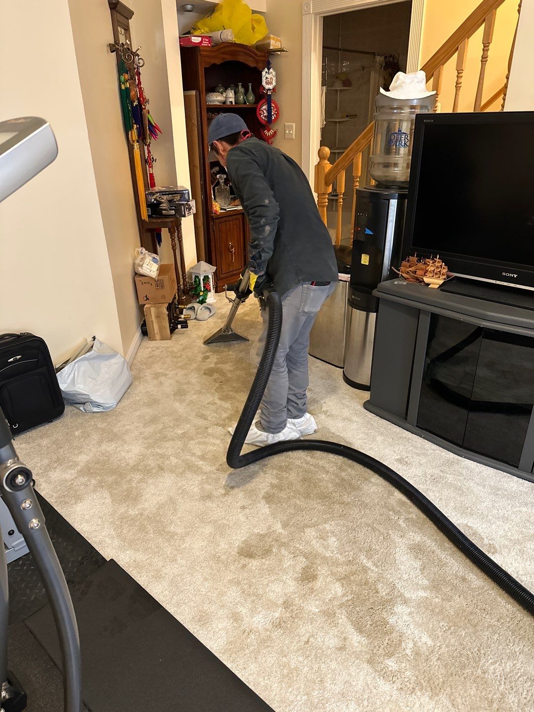 Wet carpet and flooring removal in progress as part of water restoration work.
