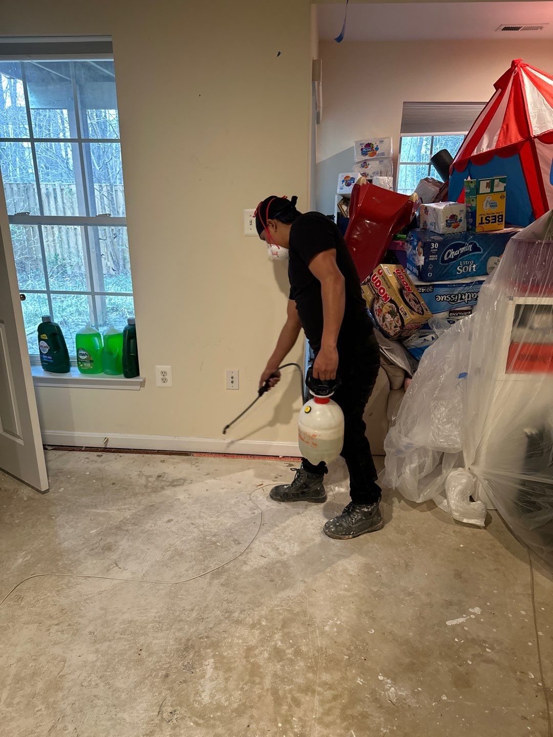 Mold remediation in Centreville: dehumidifier and drying equipment positioned in affected room during initial assessment.