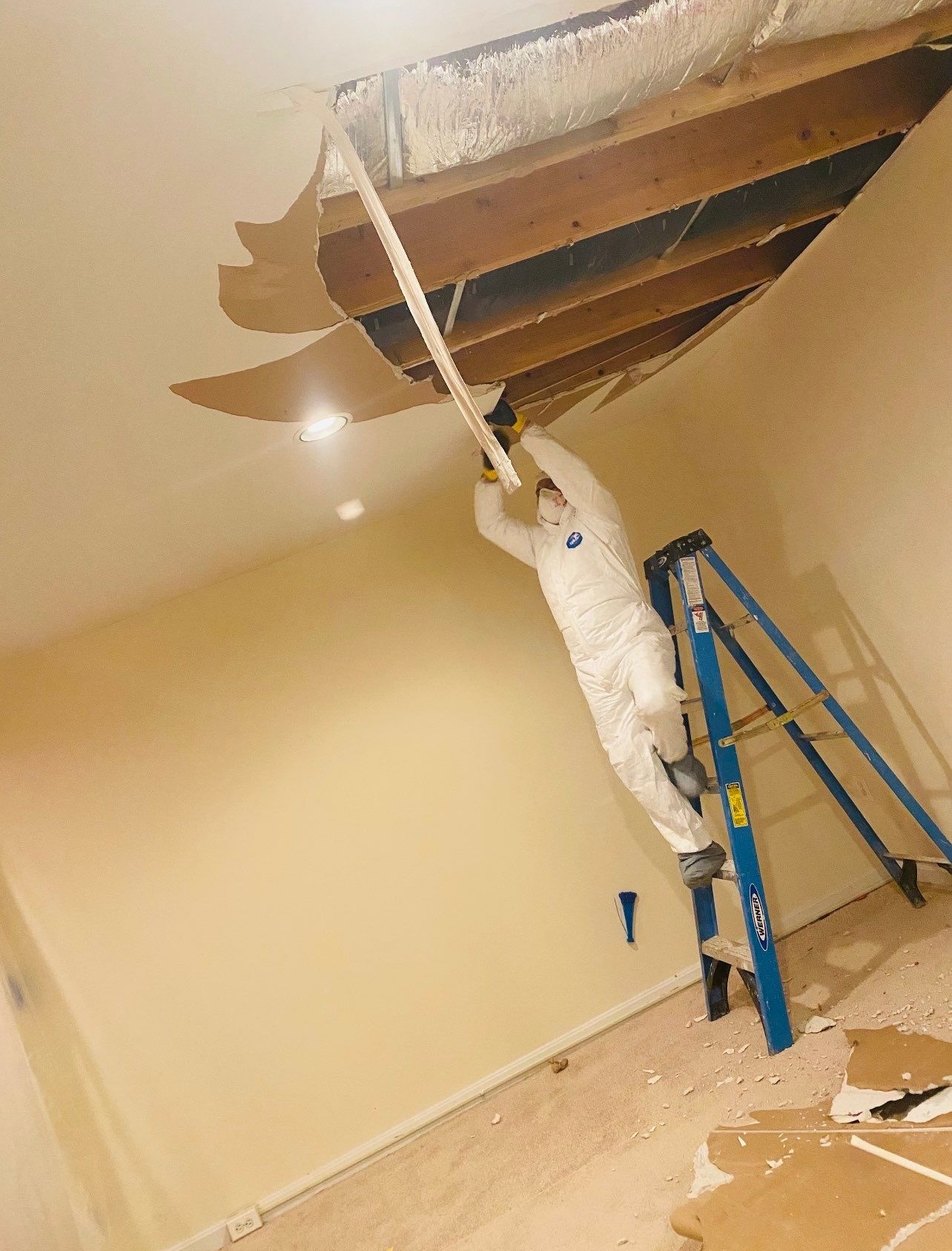 Ceiling repair completed; room restored after mold remediation and structural drying finished.