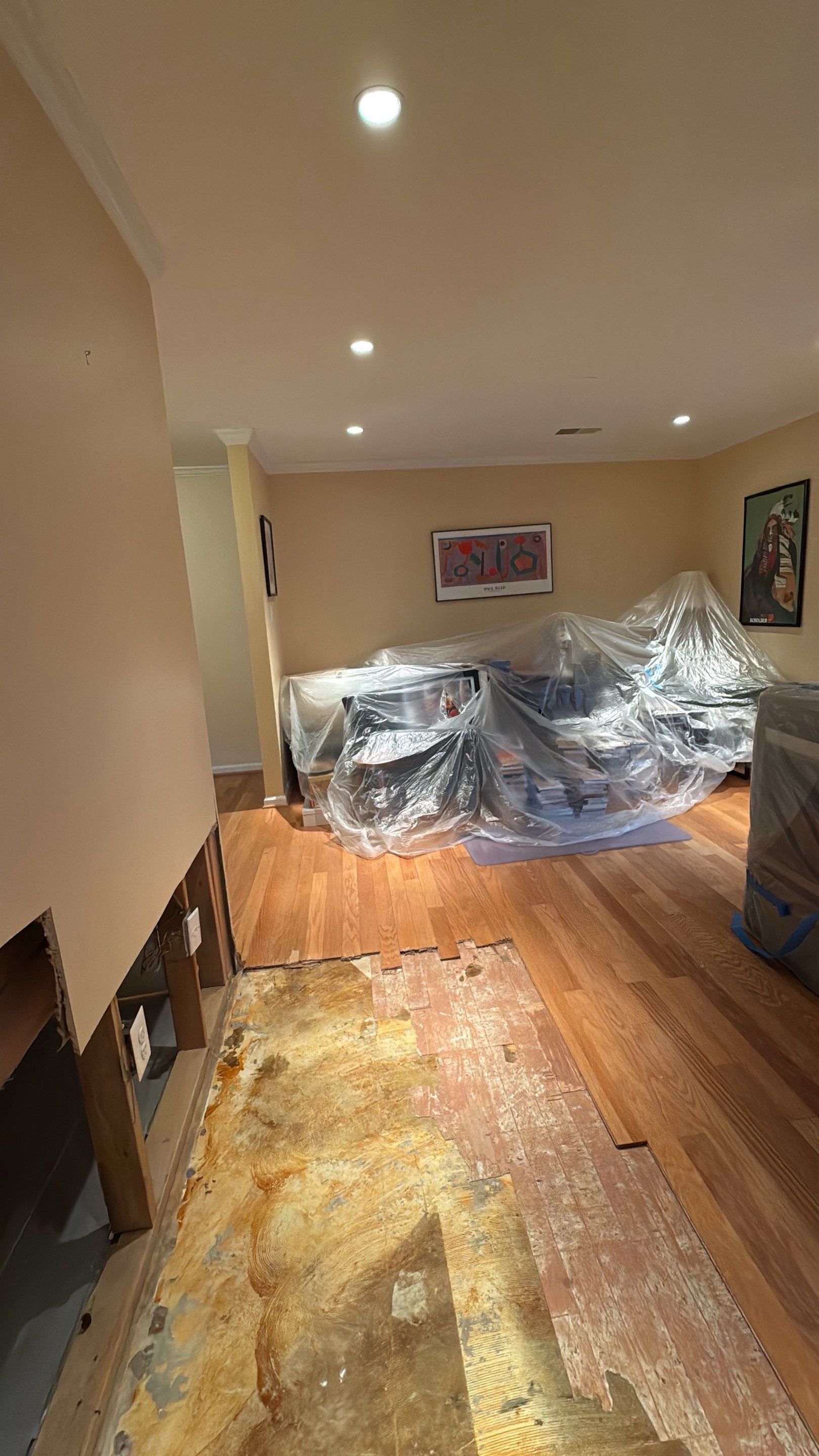 Drying process in progress, dehumidifiers and air movers working to dry affected building materials.