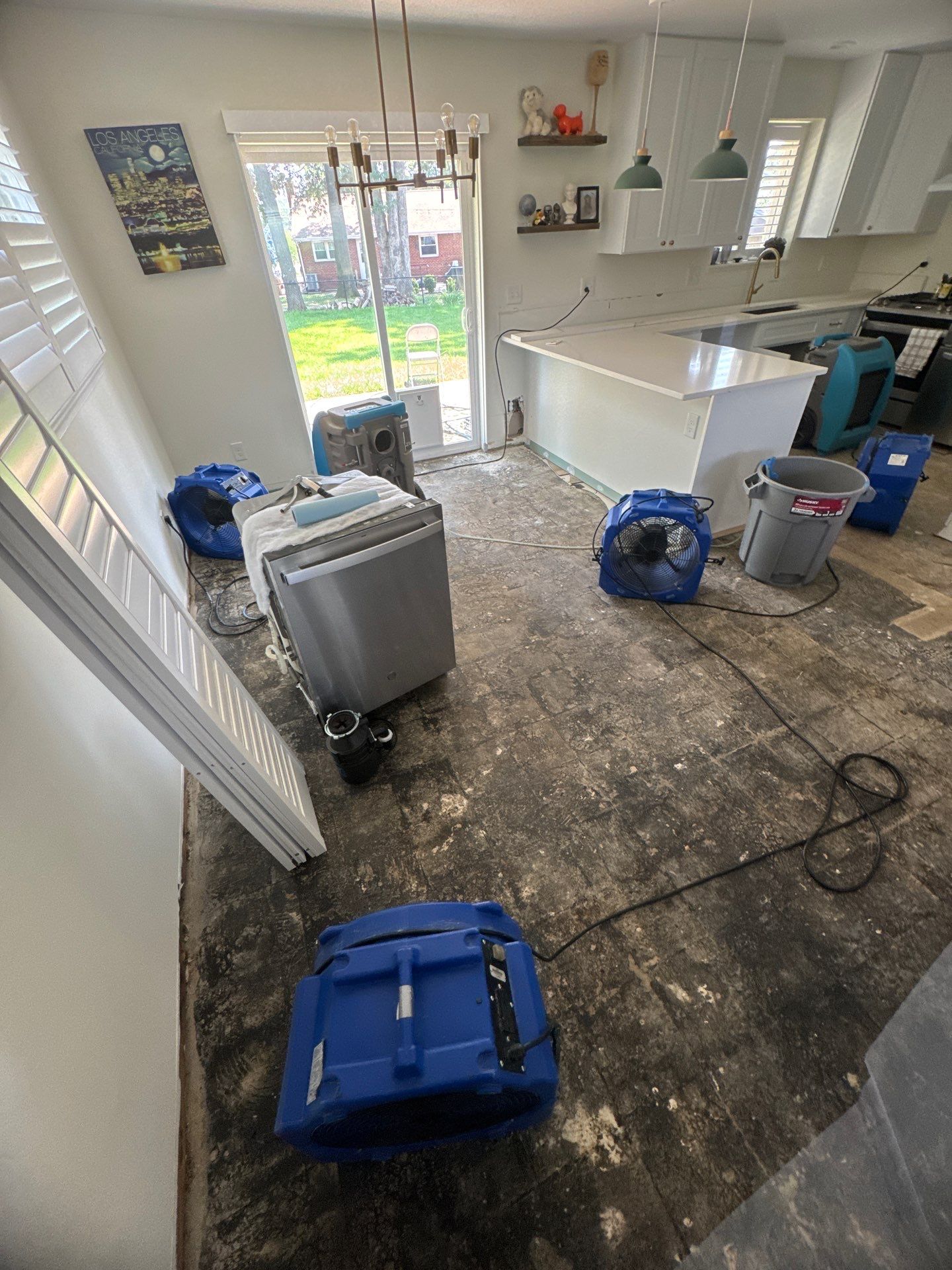 Water extraction equipment positioned within containment during mid-stage structural drying in Springfield.