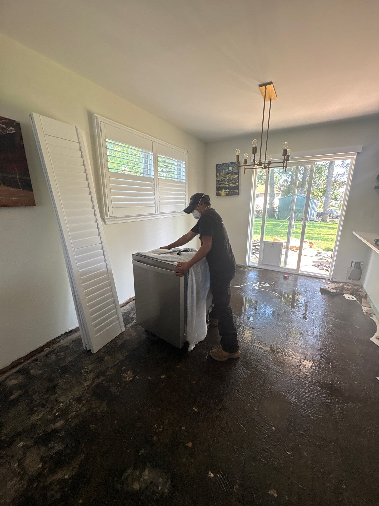 Dehumidification and air movement setup within sealed containment barrier during water damage restoration.