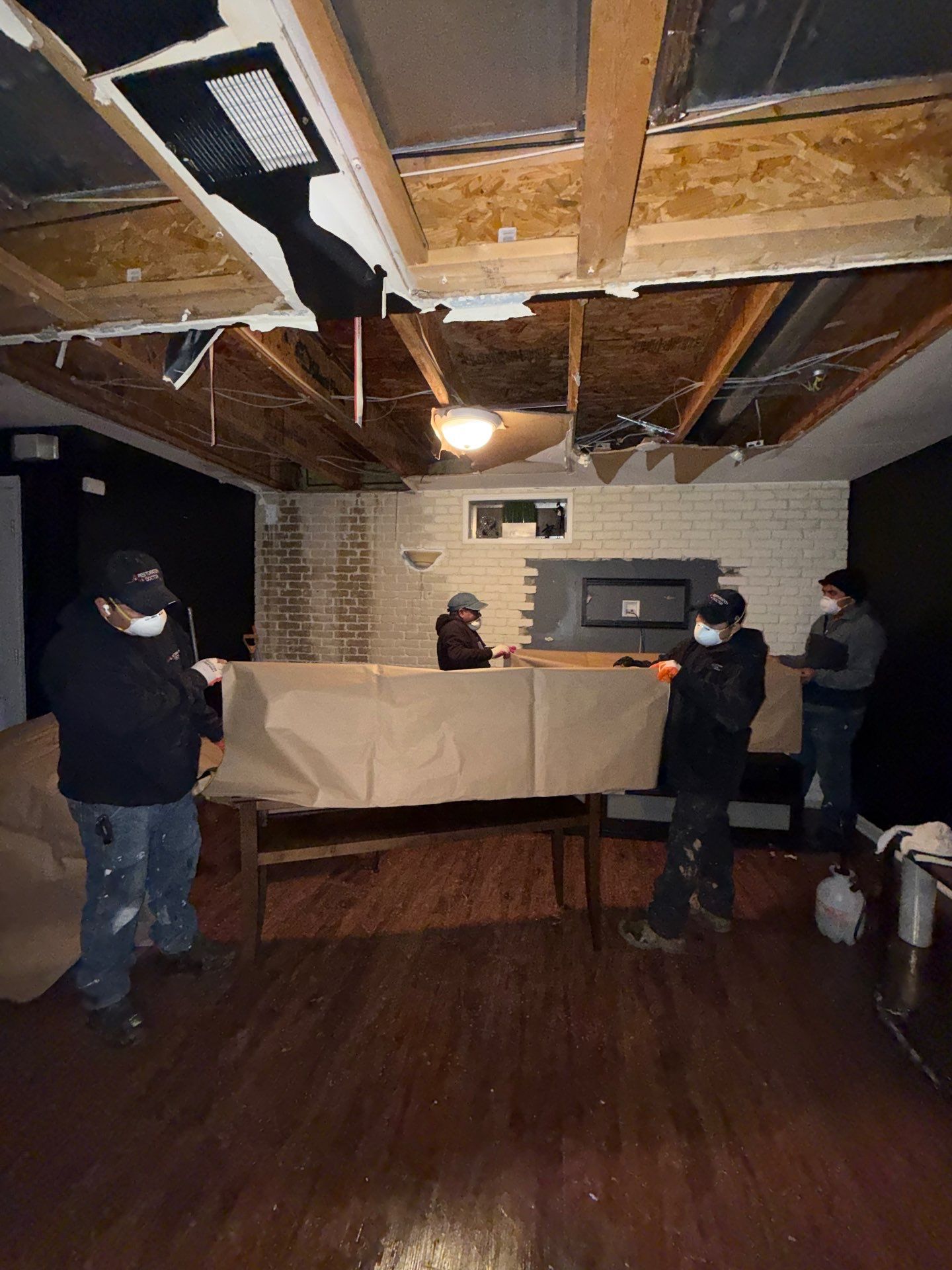Ceiling framing and substrate prepared for replacement following water damage mitigation in Manassas.