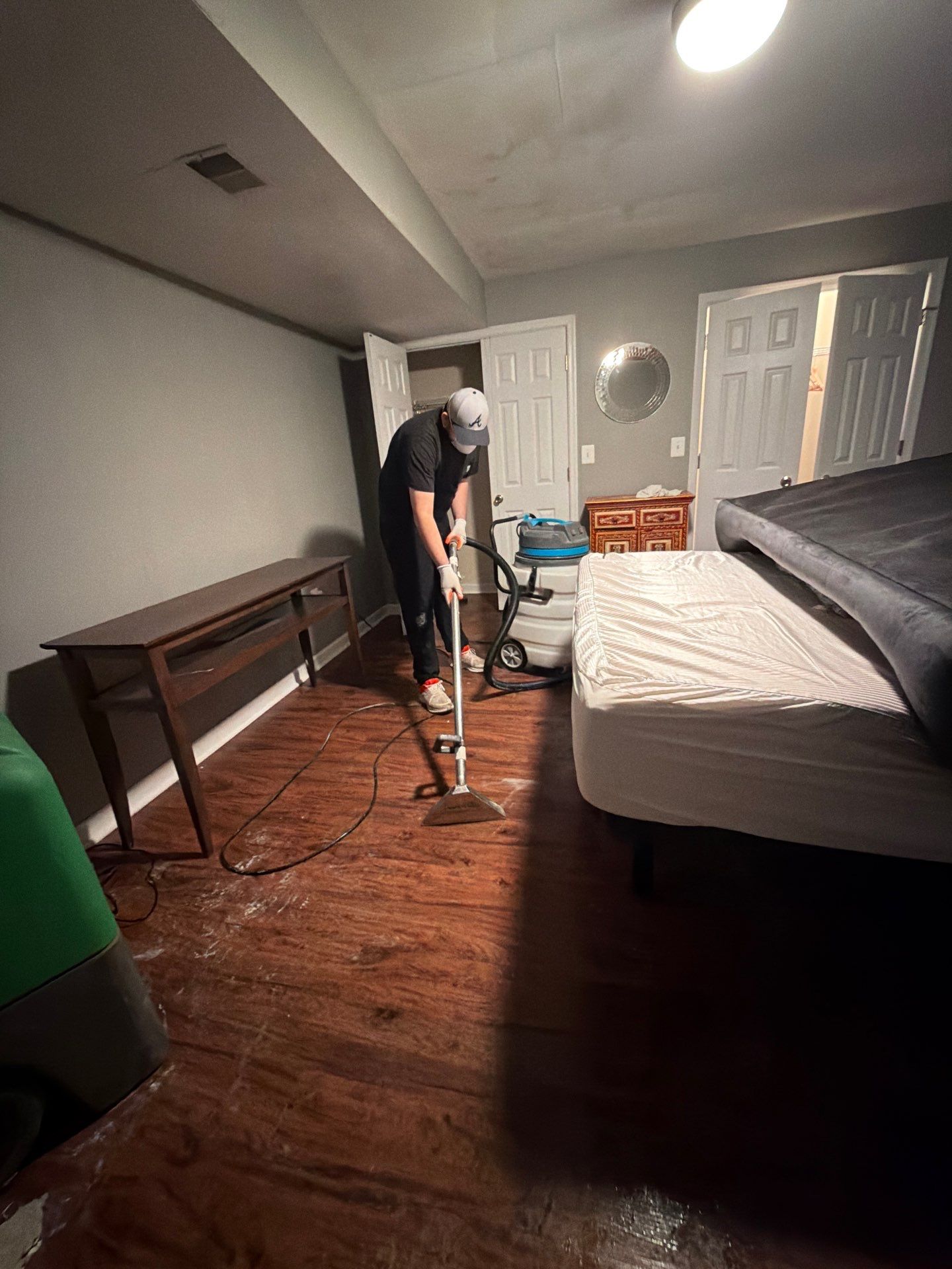 Protective sheeting installed over furnishings during water damage restoration work in Manassas.