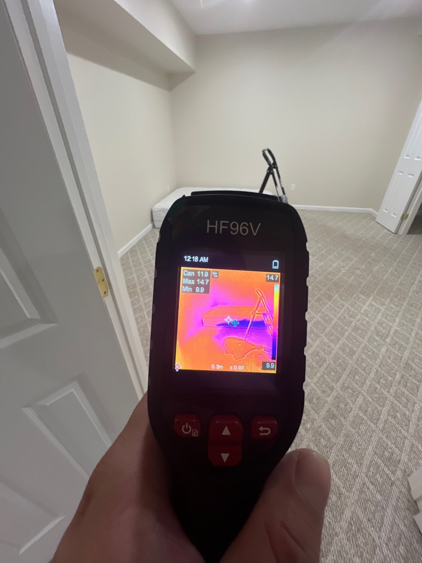 Structural drying equipment positioned to remove moisture from affected ceiling cavity and framing.