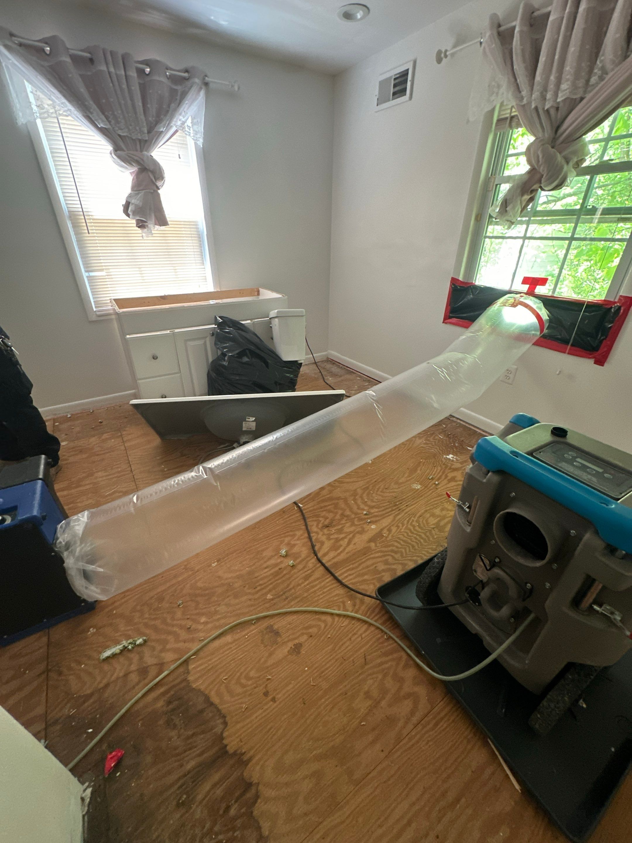 Final-stage water restoration in Falls Church showing dried flooring and equipment removal after structural drying complete.