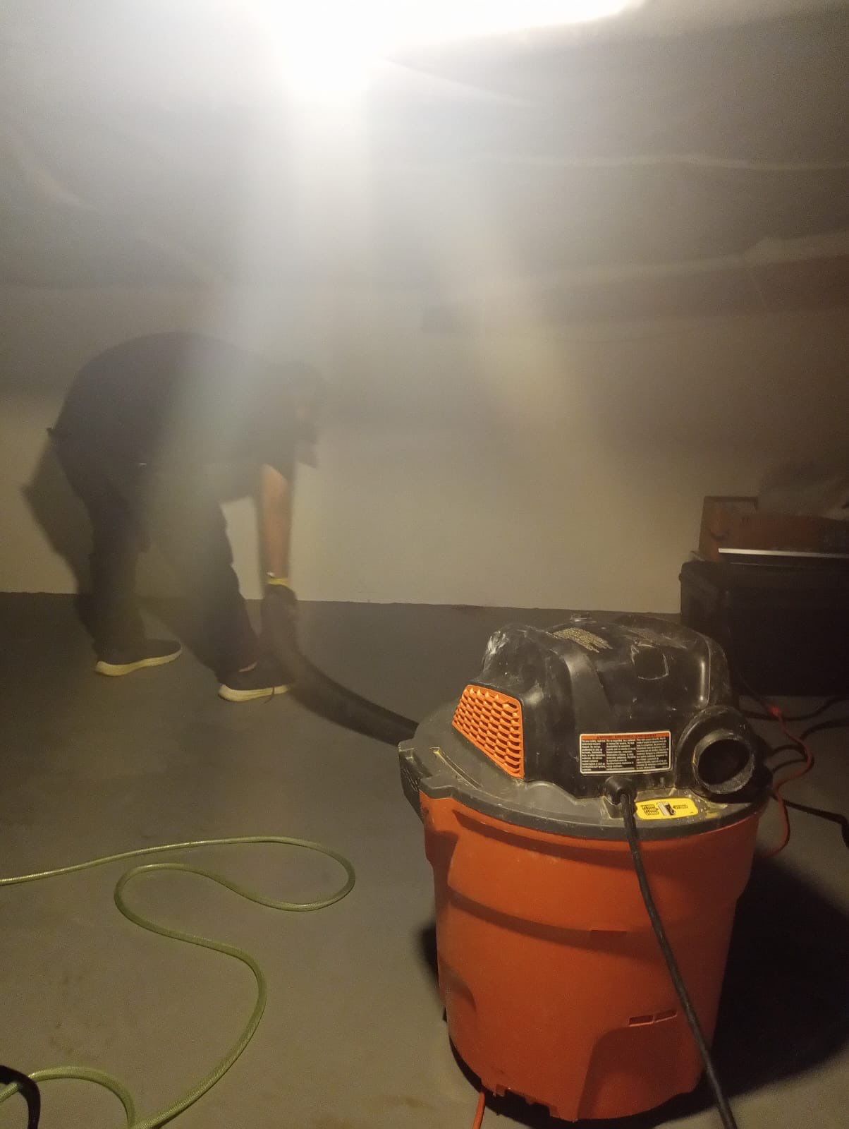 Standing water extraction underway during water damage restoration in Alexandria, Virginia.