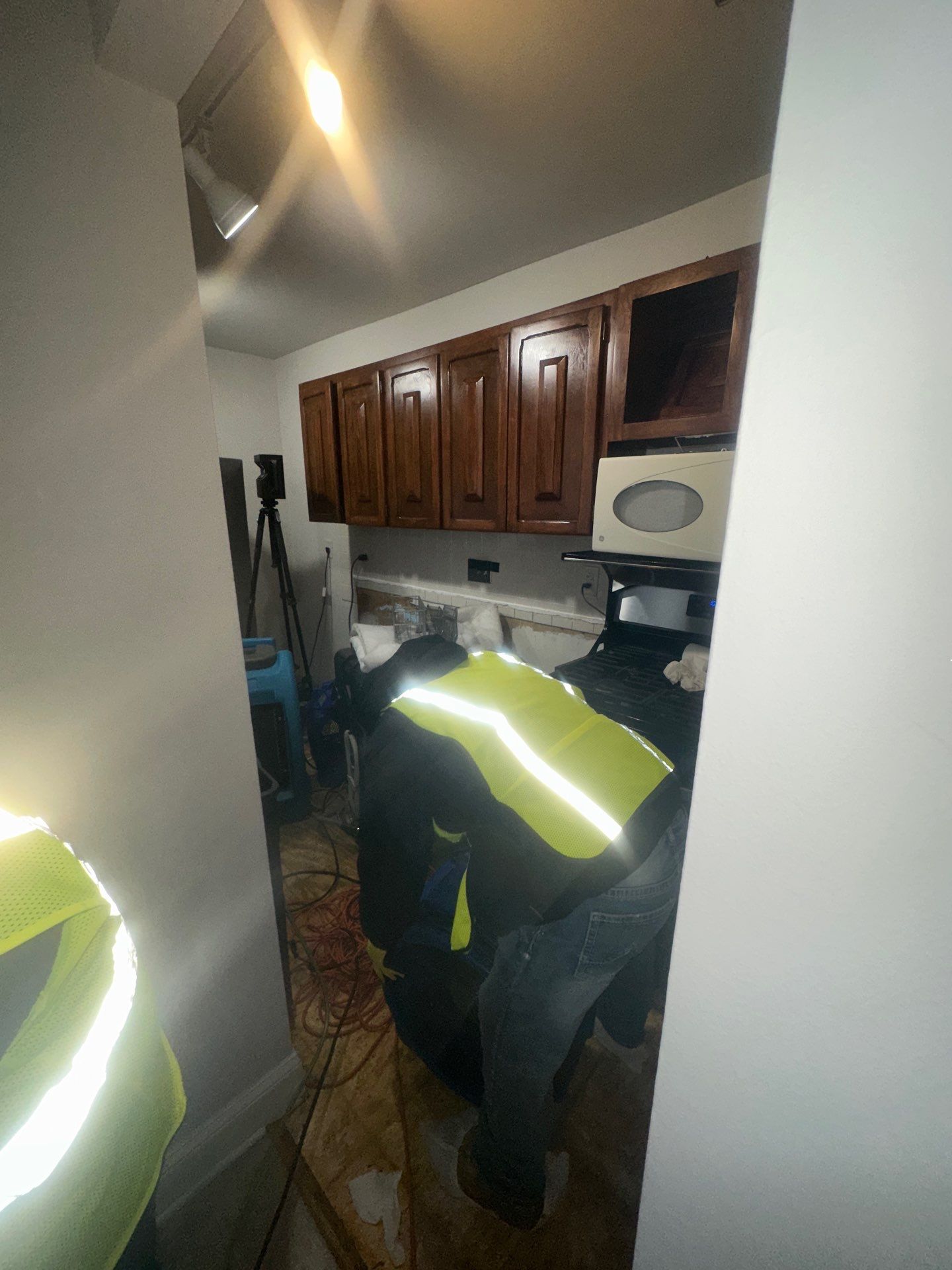 Dehumidification equipment positioned during mid-stage drying to manage moisture levels in water-damaged structure.