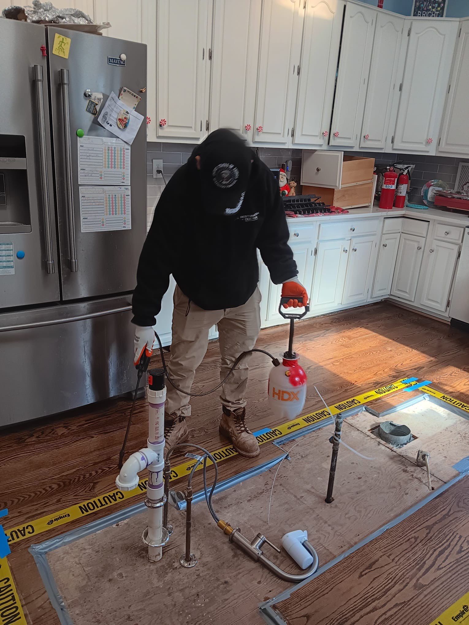 Continued drying and monitoring of moisture levels in structural materials.