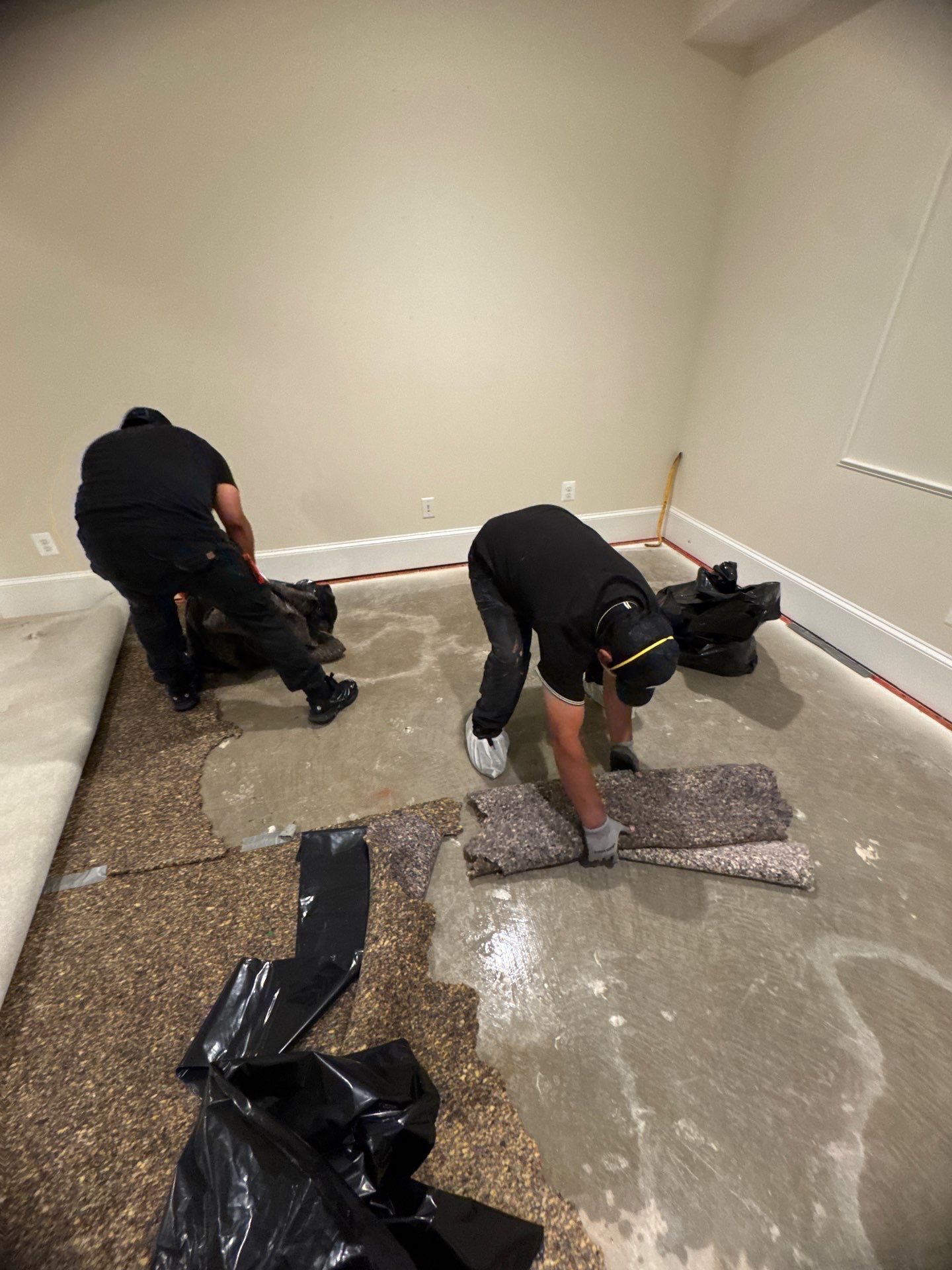Standing water extraction underway in Church home during water damage restoration.