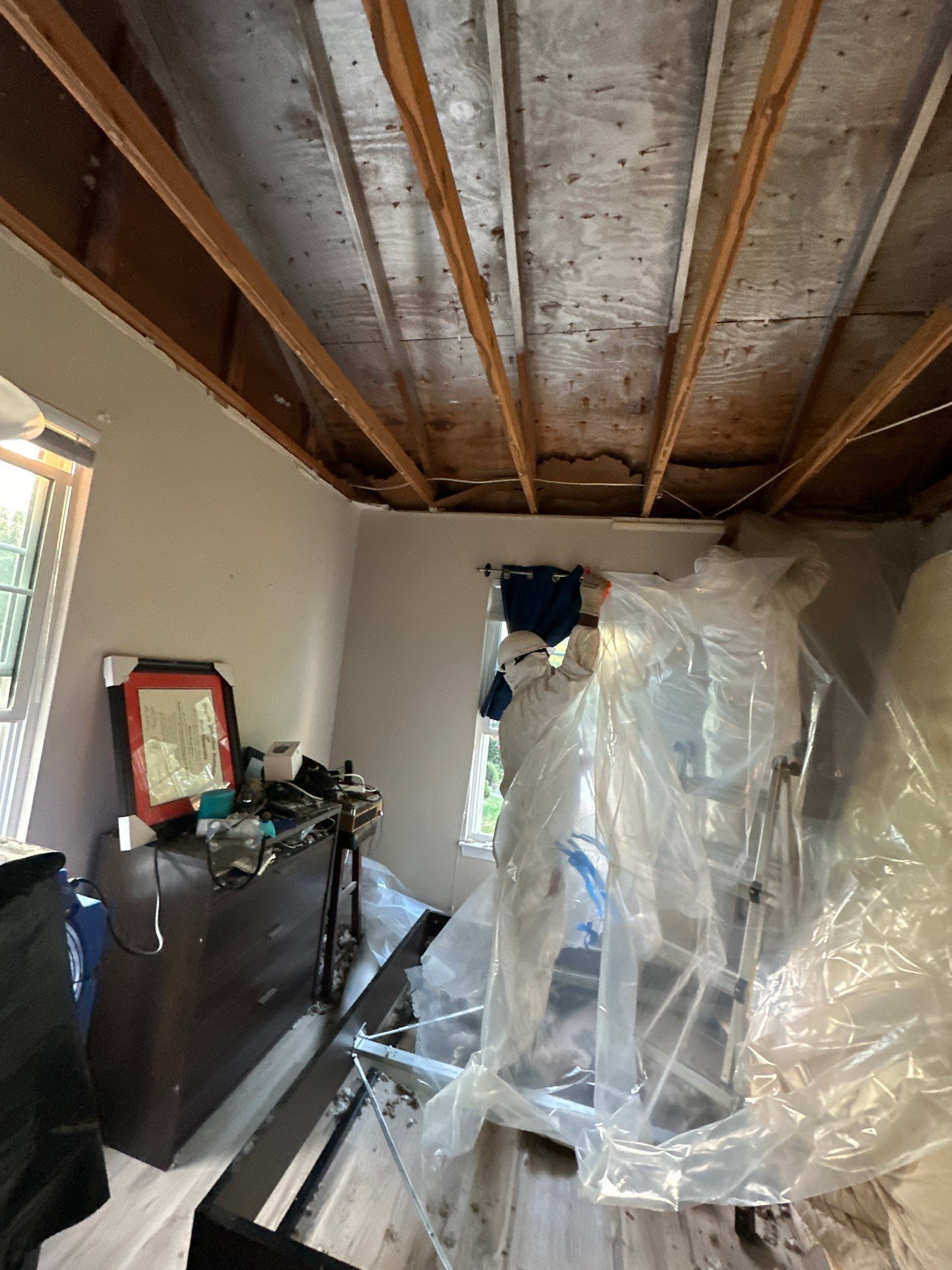 Mid-stage drying setup with dehumidifiers and extraction equipment in water damage restoration.