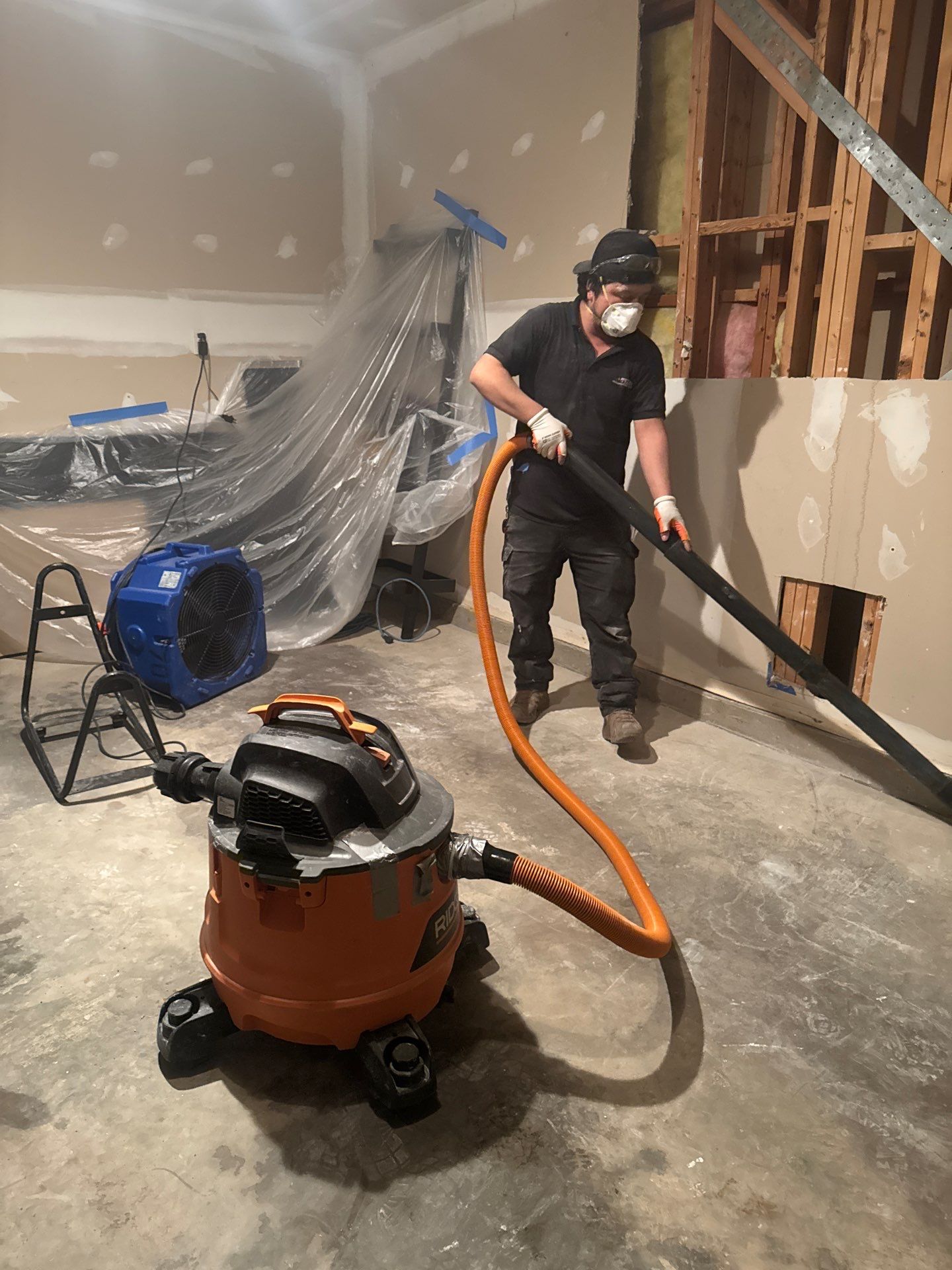 Drywall replacement in progress, new panels installed to restore wall integrity.