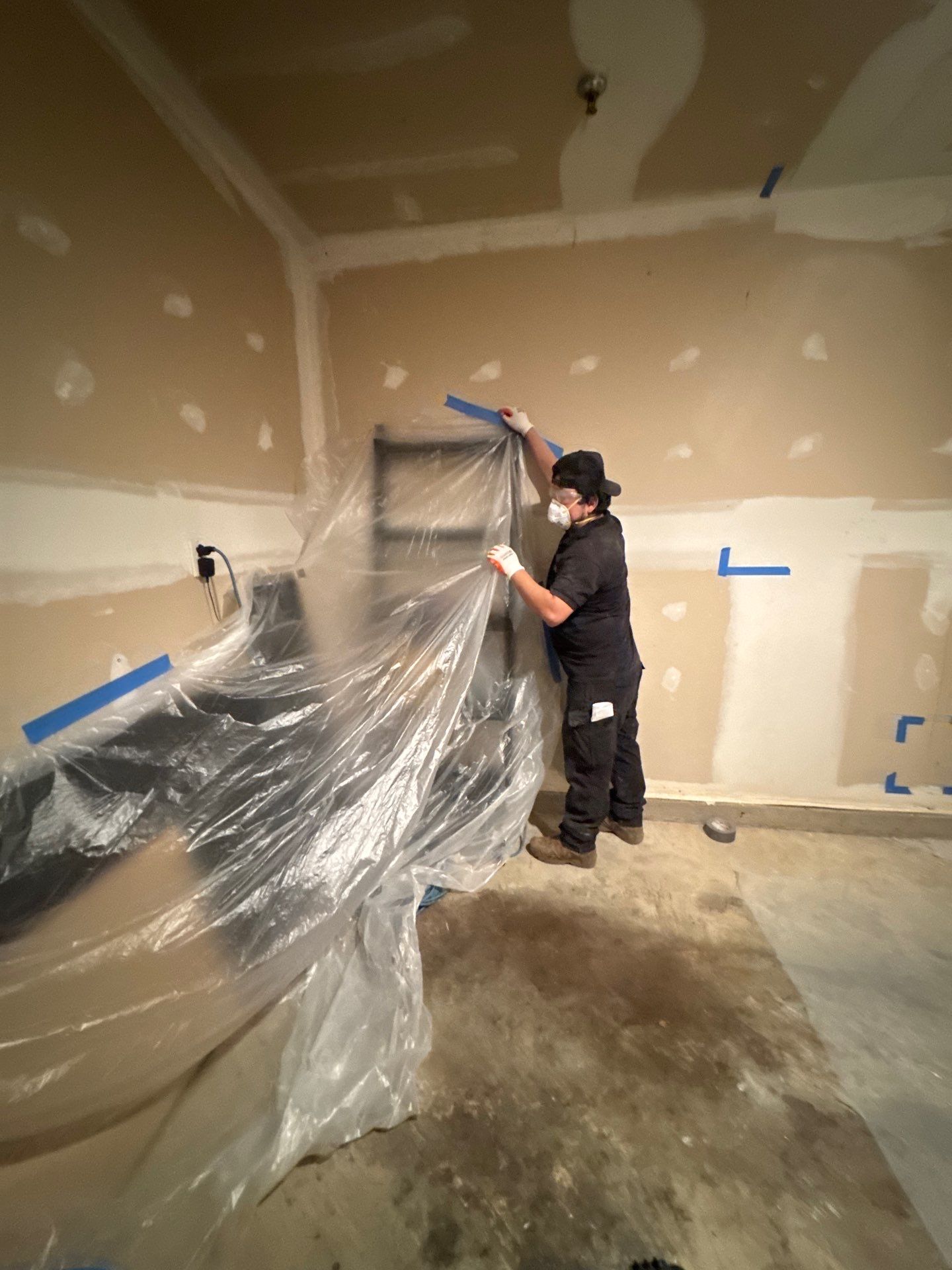 Framing exposure and assessment after saturated wall material removal in water restoration process.