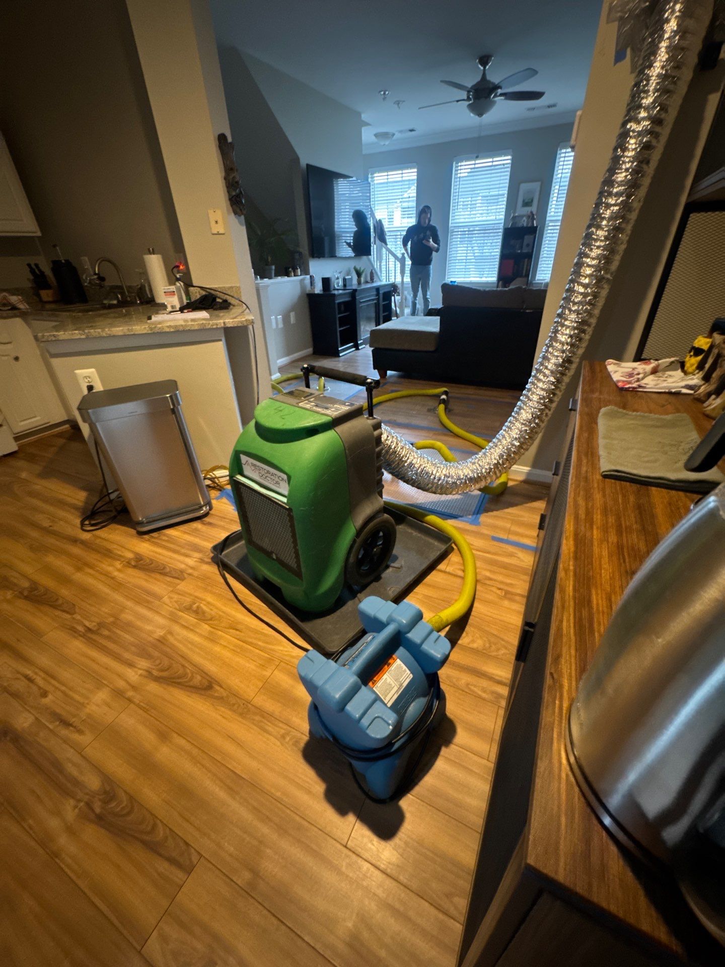 Standing water removal underway in Ashburn water damage restoration, extractors deployed across affected area.
