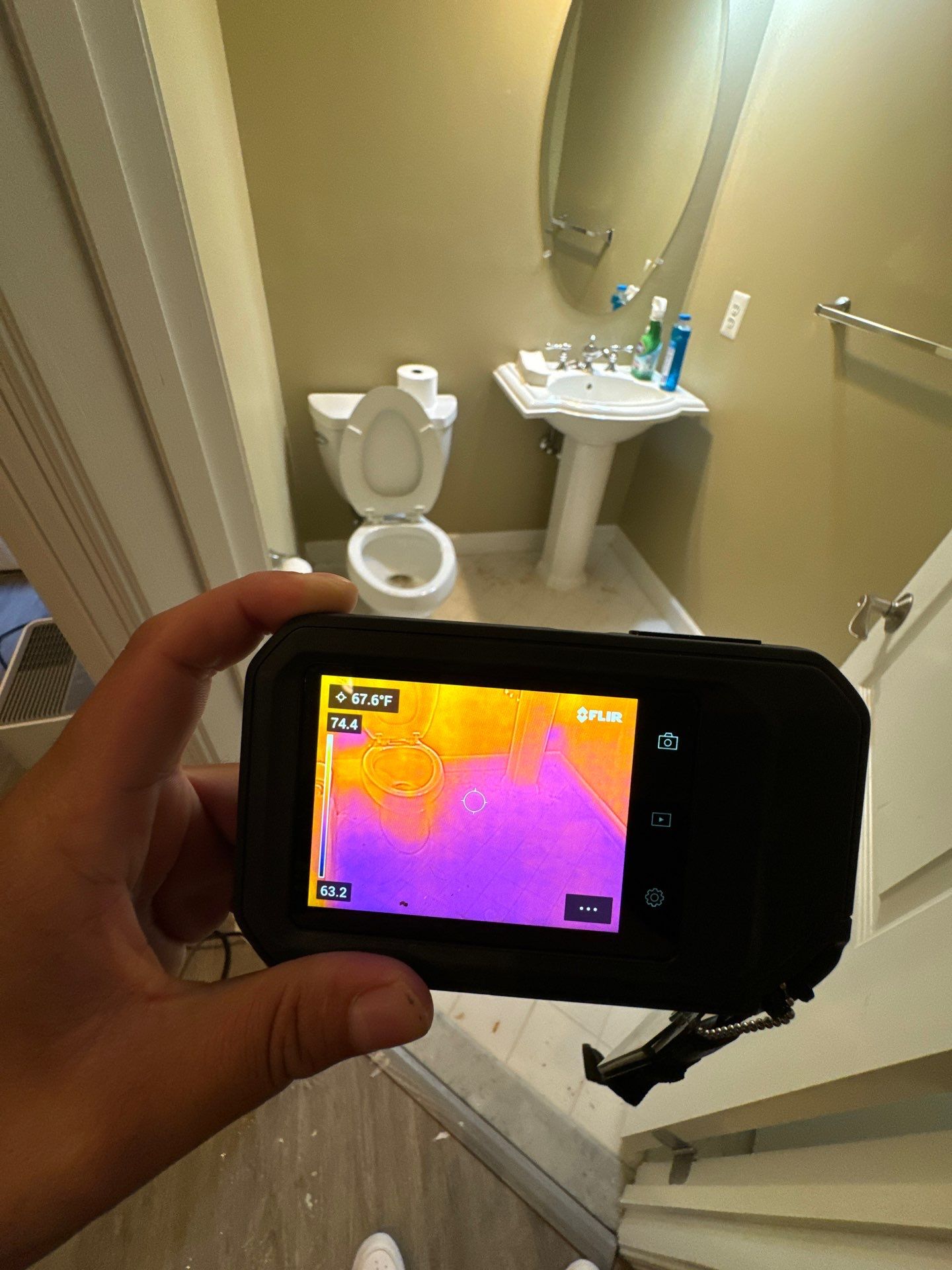 Thermal imaging camera capturing moisture distribution during water damage assessment in Leesburg.