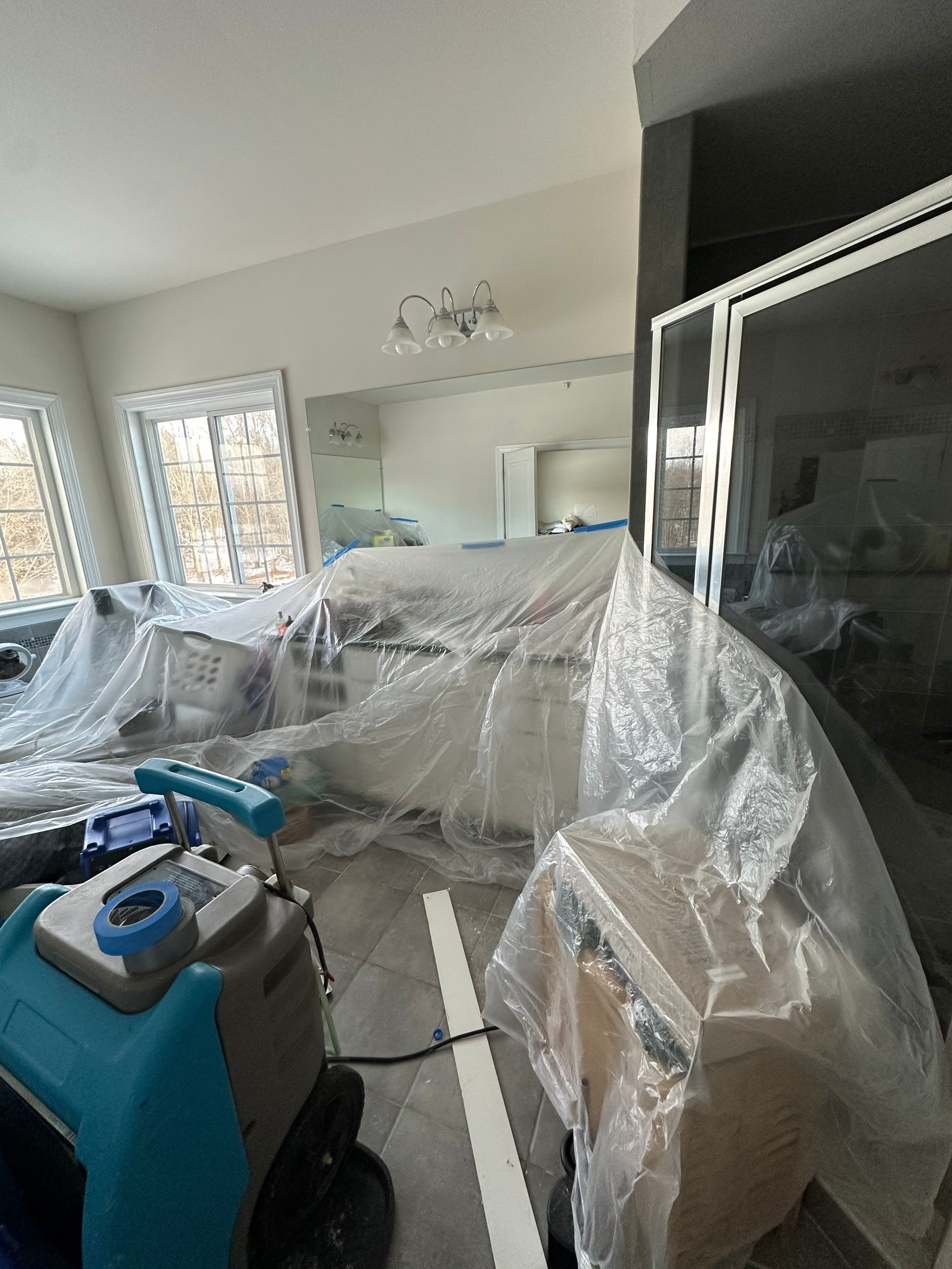 Water damage restoration in Leesburg: wet flooring and carpet requiring removal and structural drying.