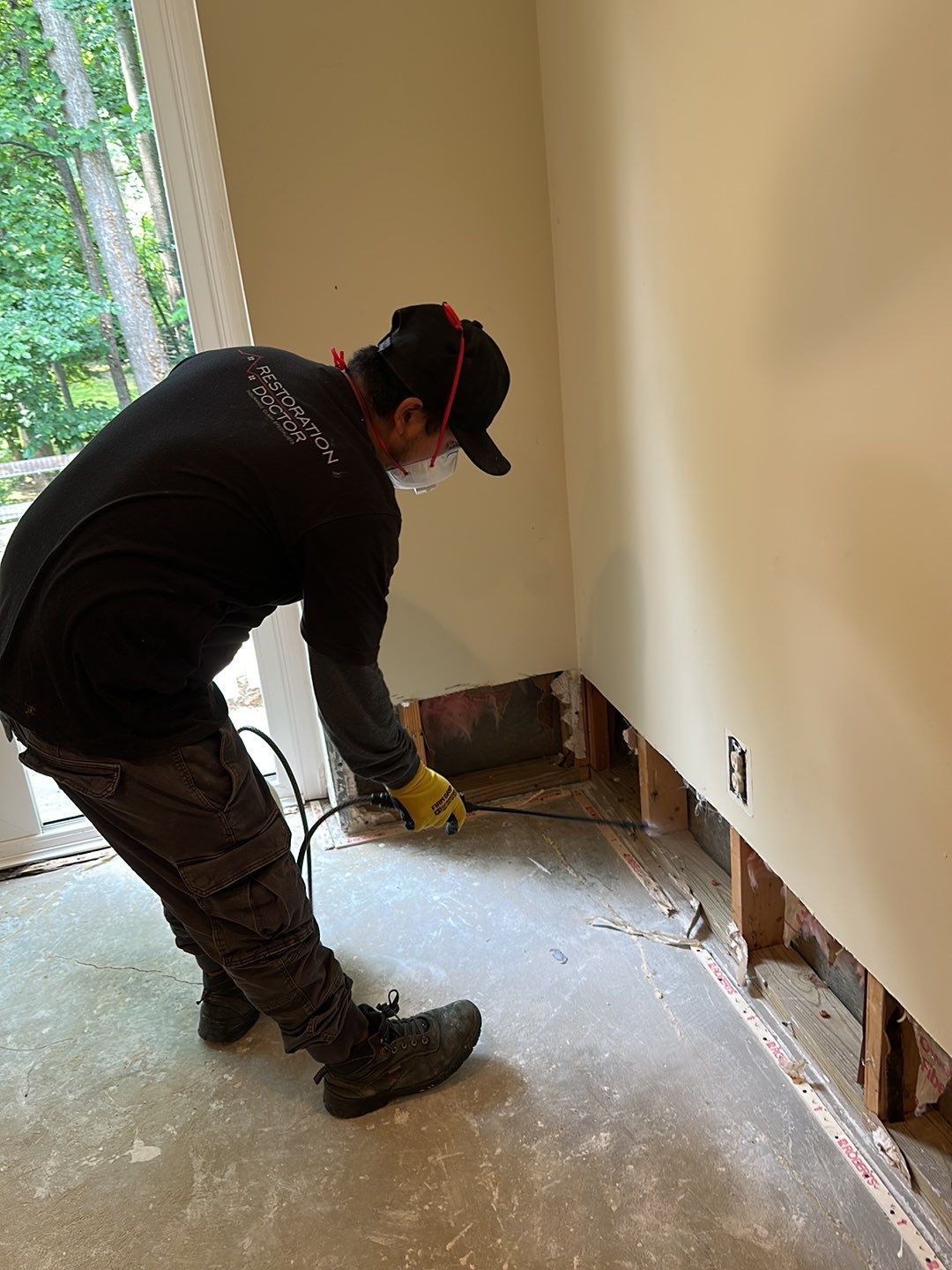 Moisture mapping in progress across affected materials during Burke water damage mitigation.