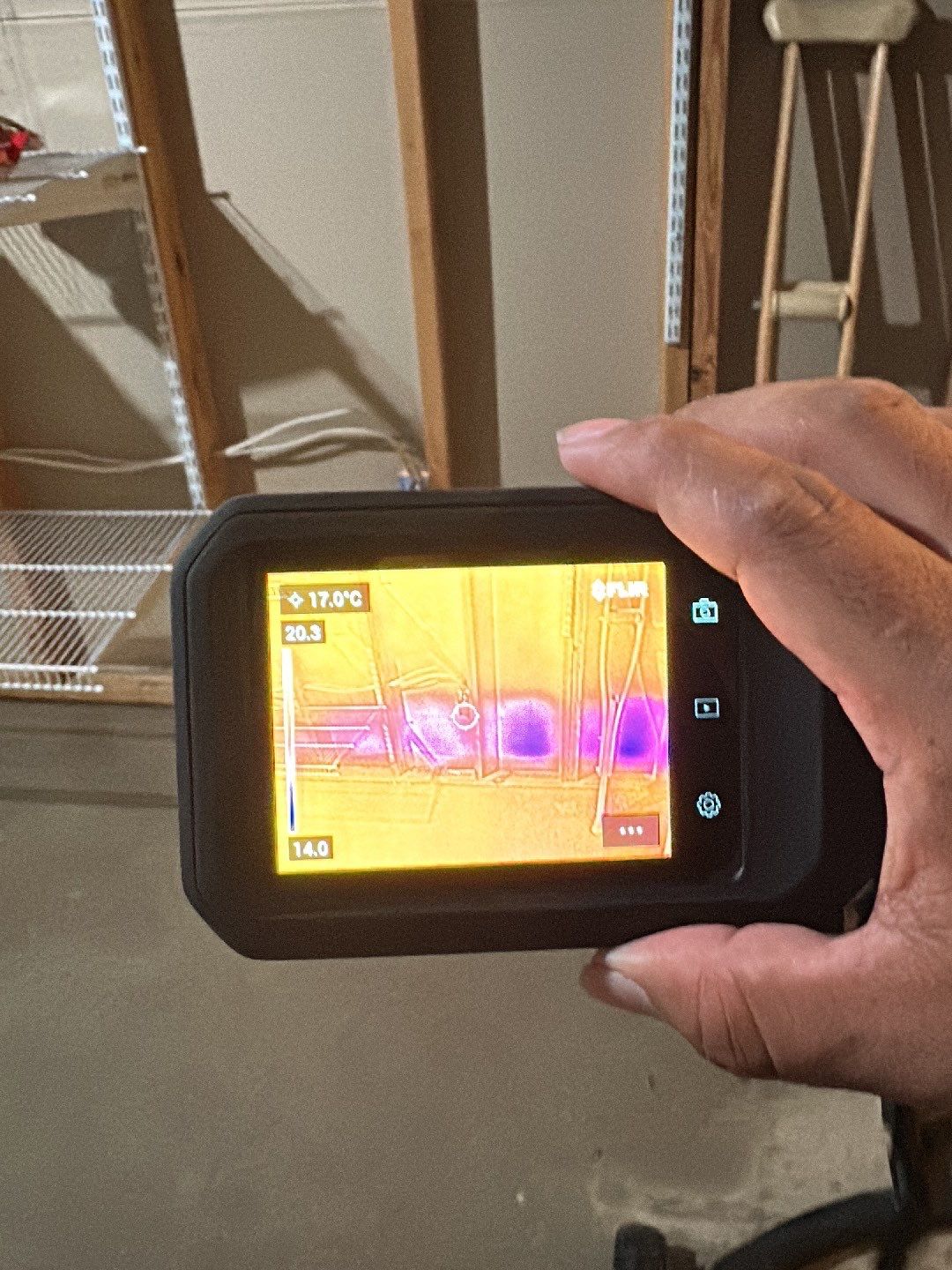 Thermal imaging camera documenting moisture distribution during water damage assessment in Burke.