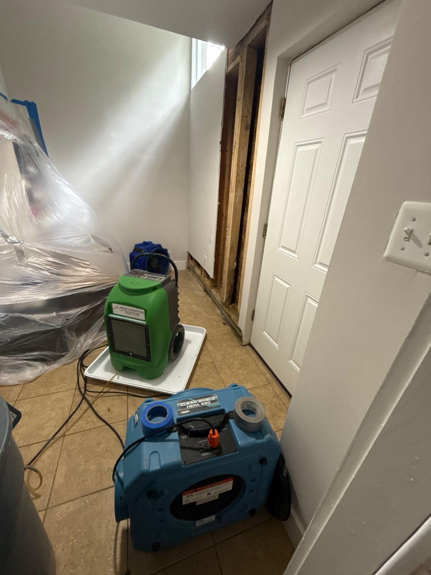 New wall assembly installed following structural drying and remediation completion.