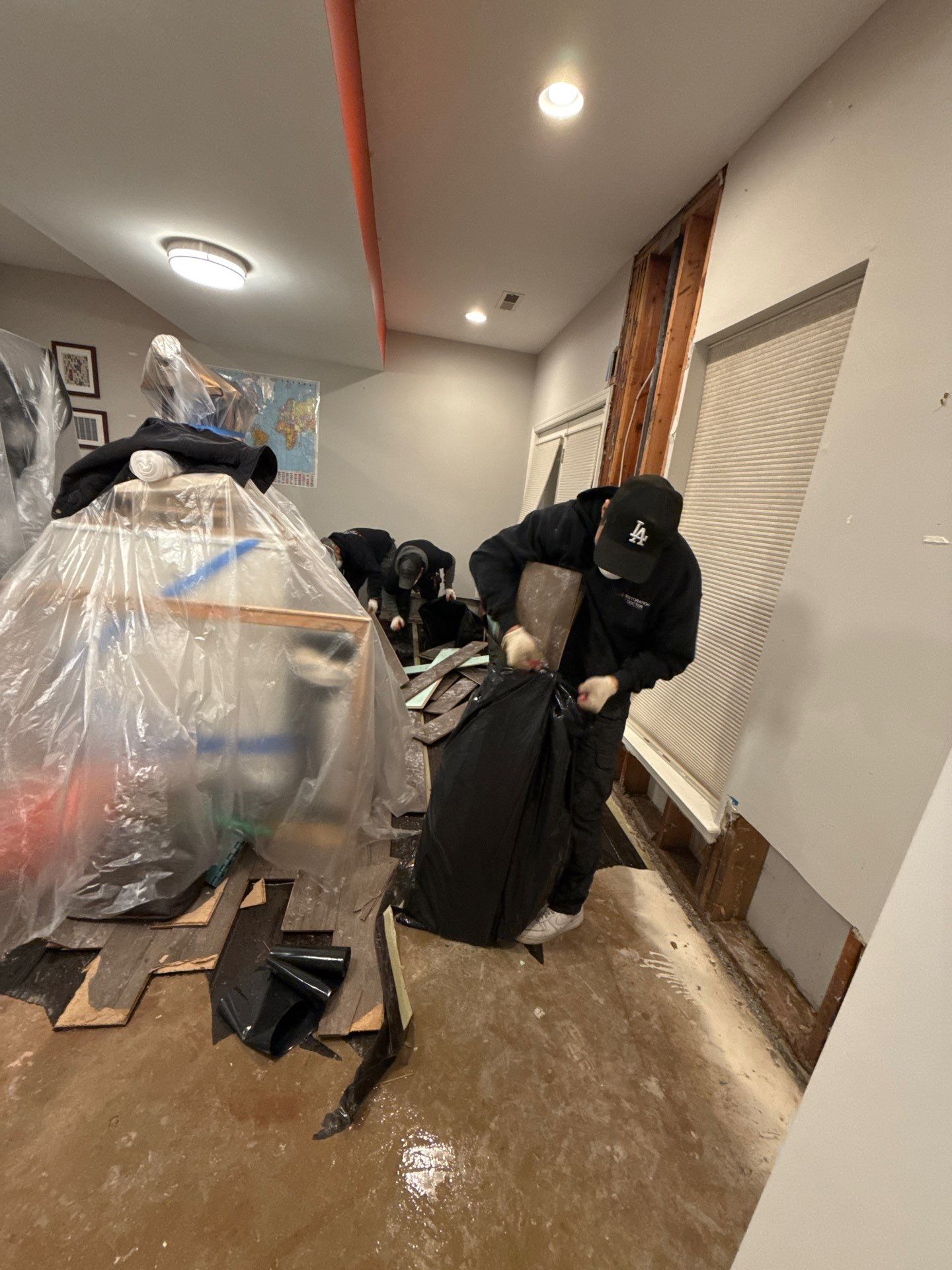 Dehumidifier and air movers operating during the drying phase of mold remediation.