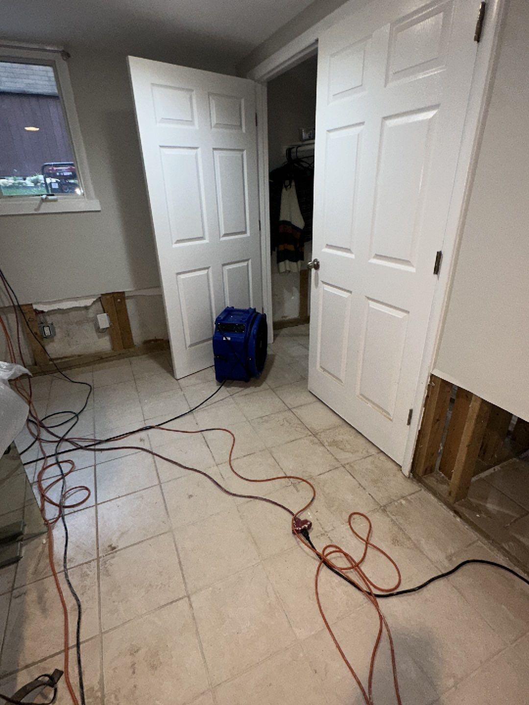 Continued moisture extraction and dehumidification work during the drying phase of water damage restoration.